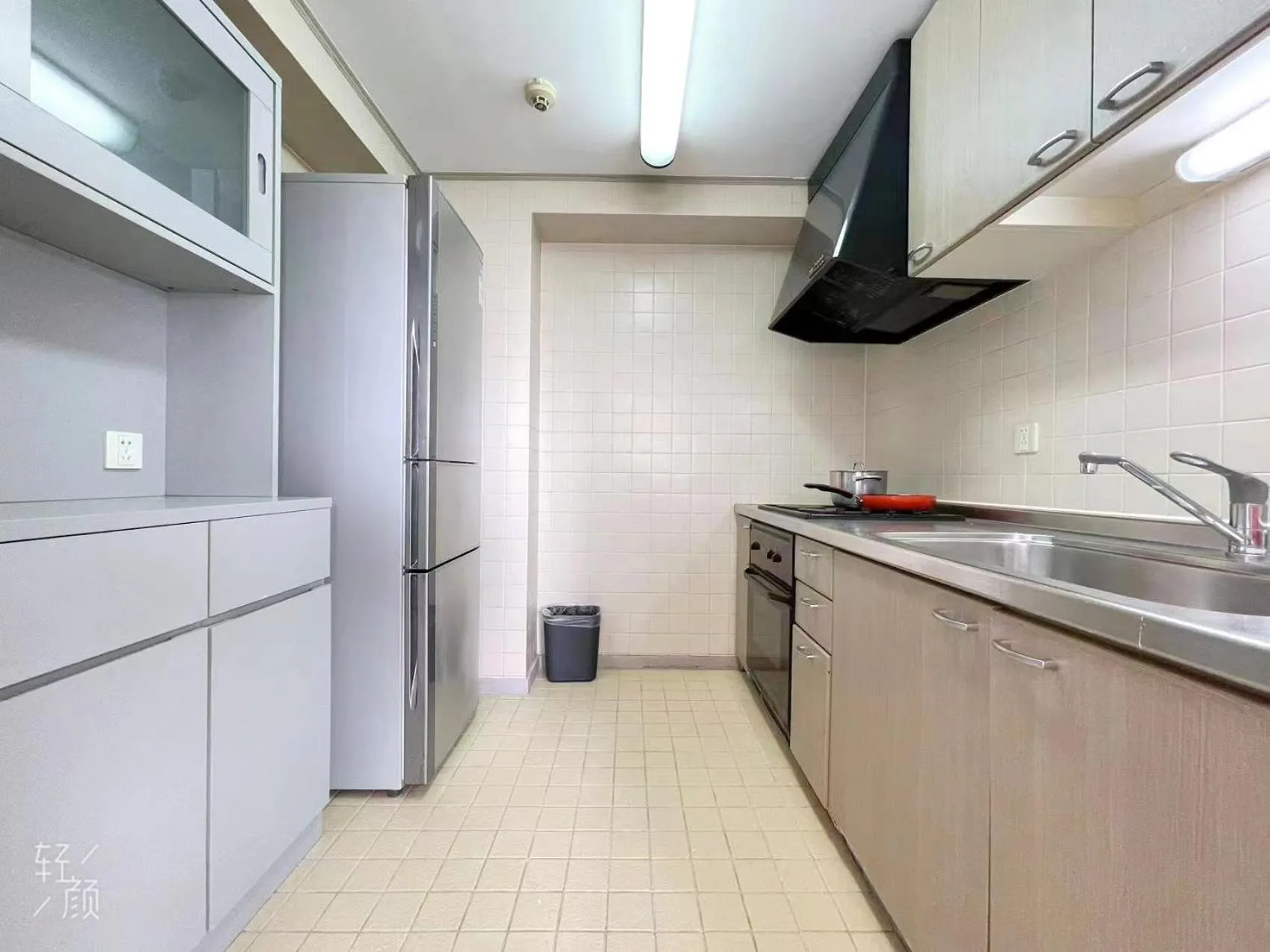 kitchen in Beijing Jiuxian Apartment
