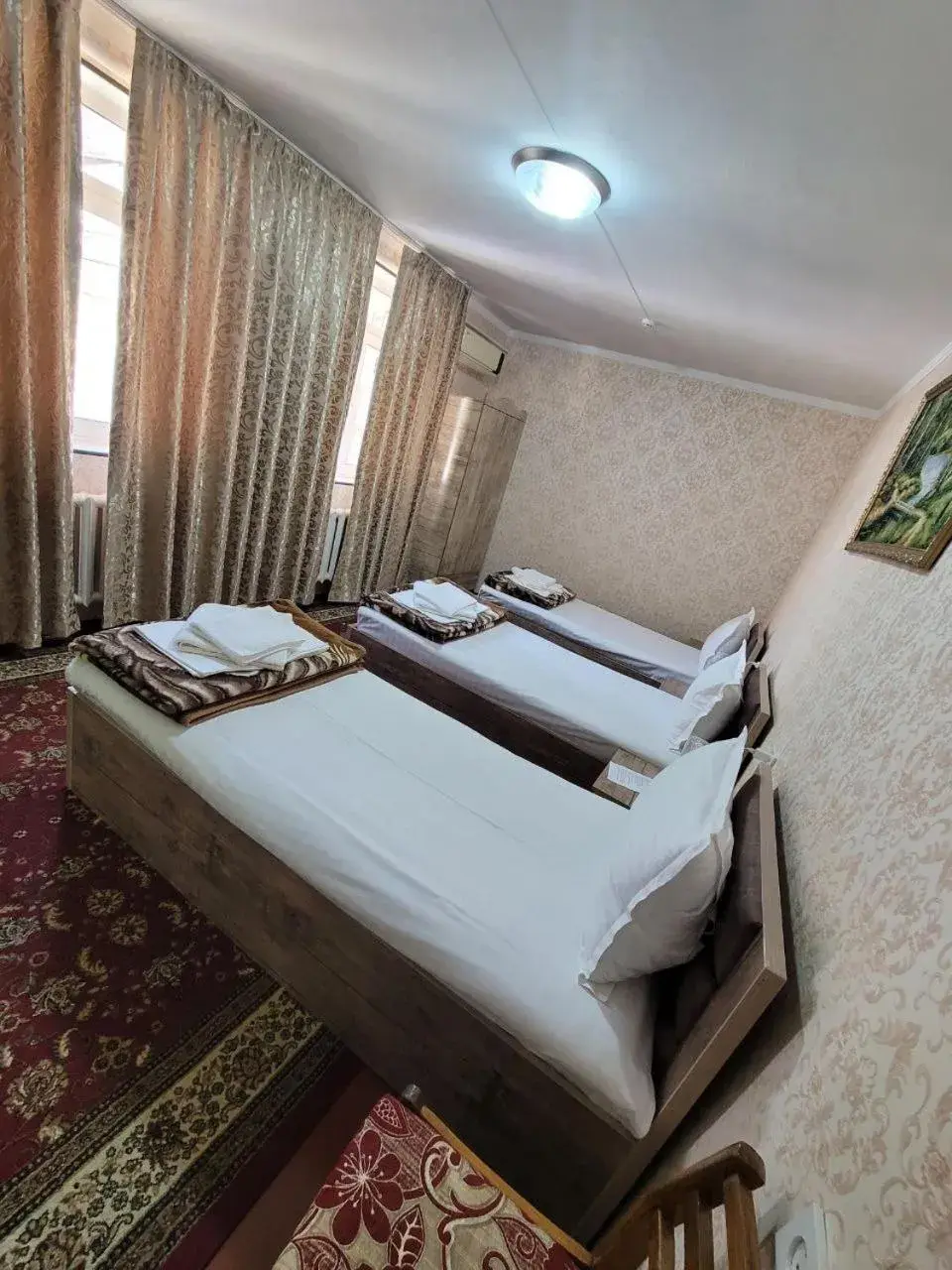 Triple Room with Bathroom - single occupancy in Gulnara Guesthouse - Hostel Triple Room with Bathroom - single occupancy in Gulnara Guesthouse - Hostel