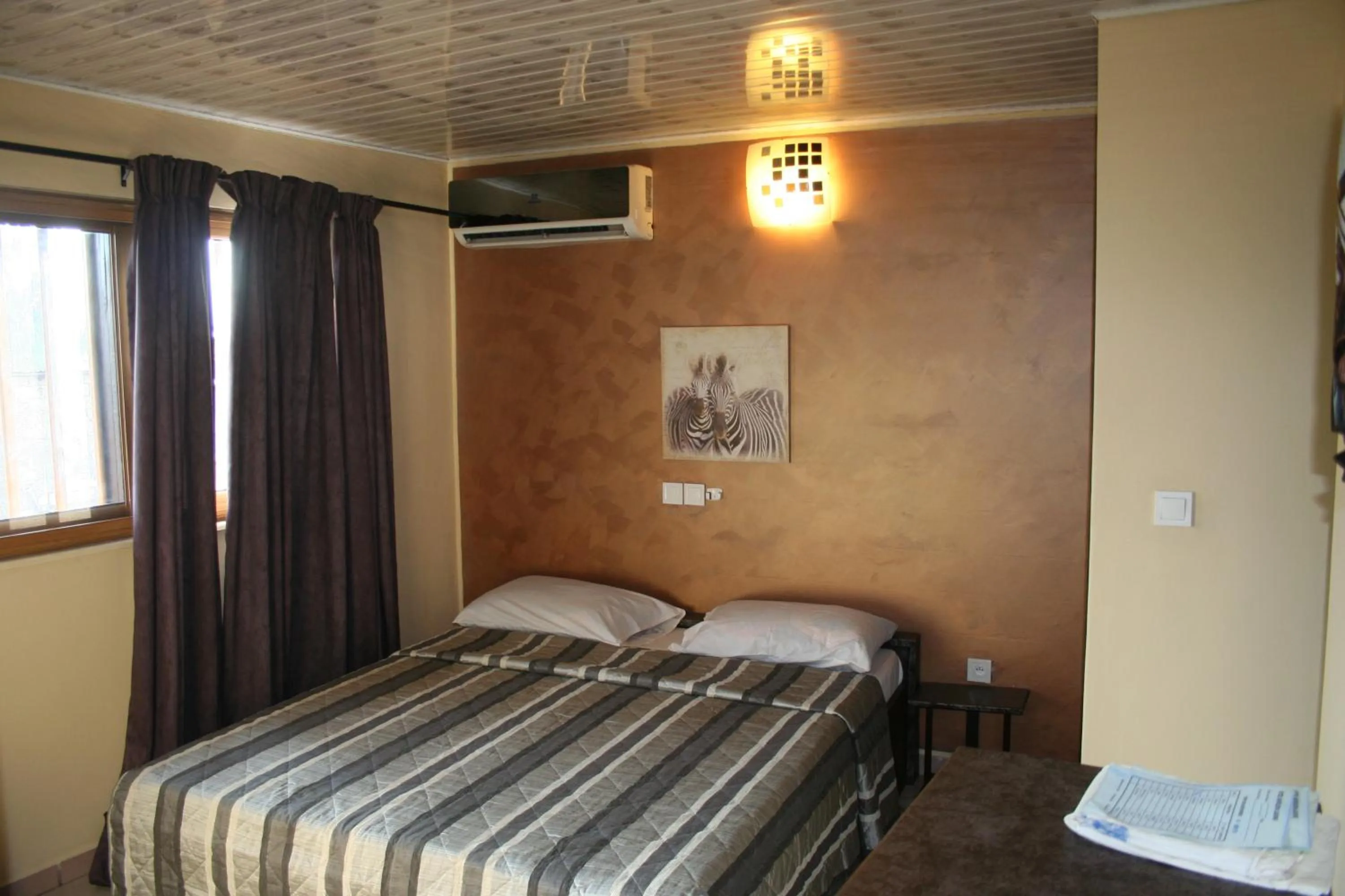 Bed in Hotel Napoleon Lagune