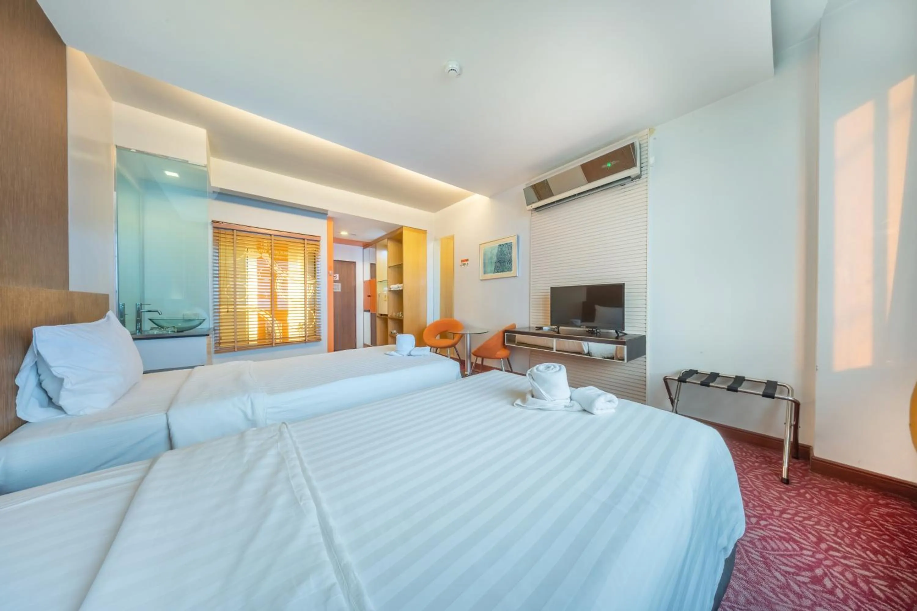 Bed in SHIN Hotel V-ONE Korat