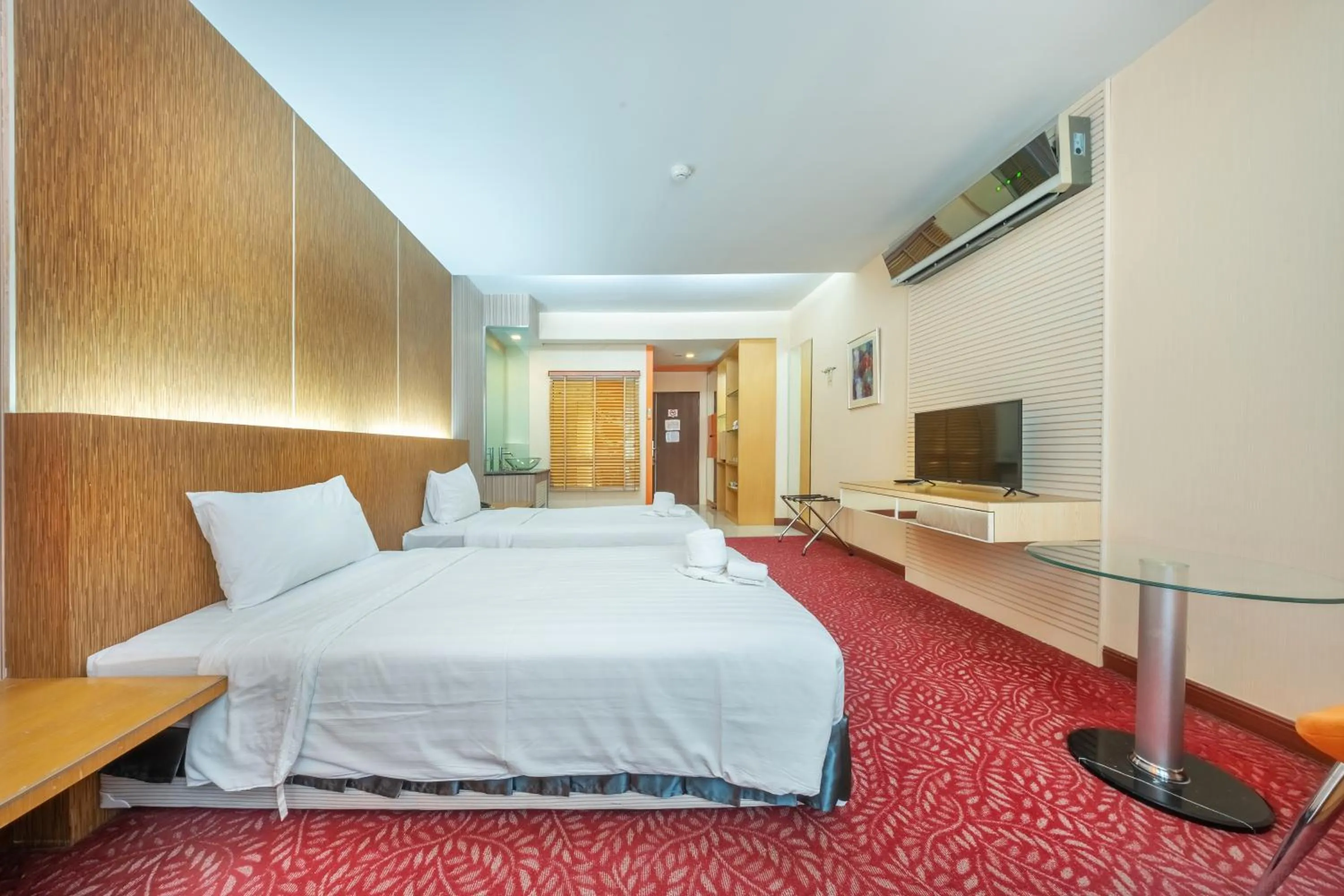 Bed in SHIN Hotel V-ONE Korat