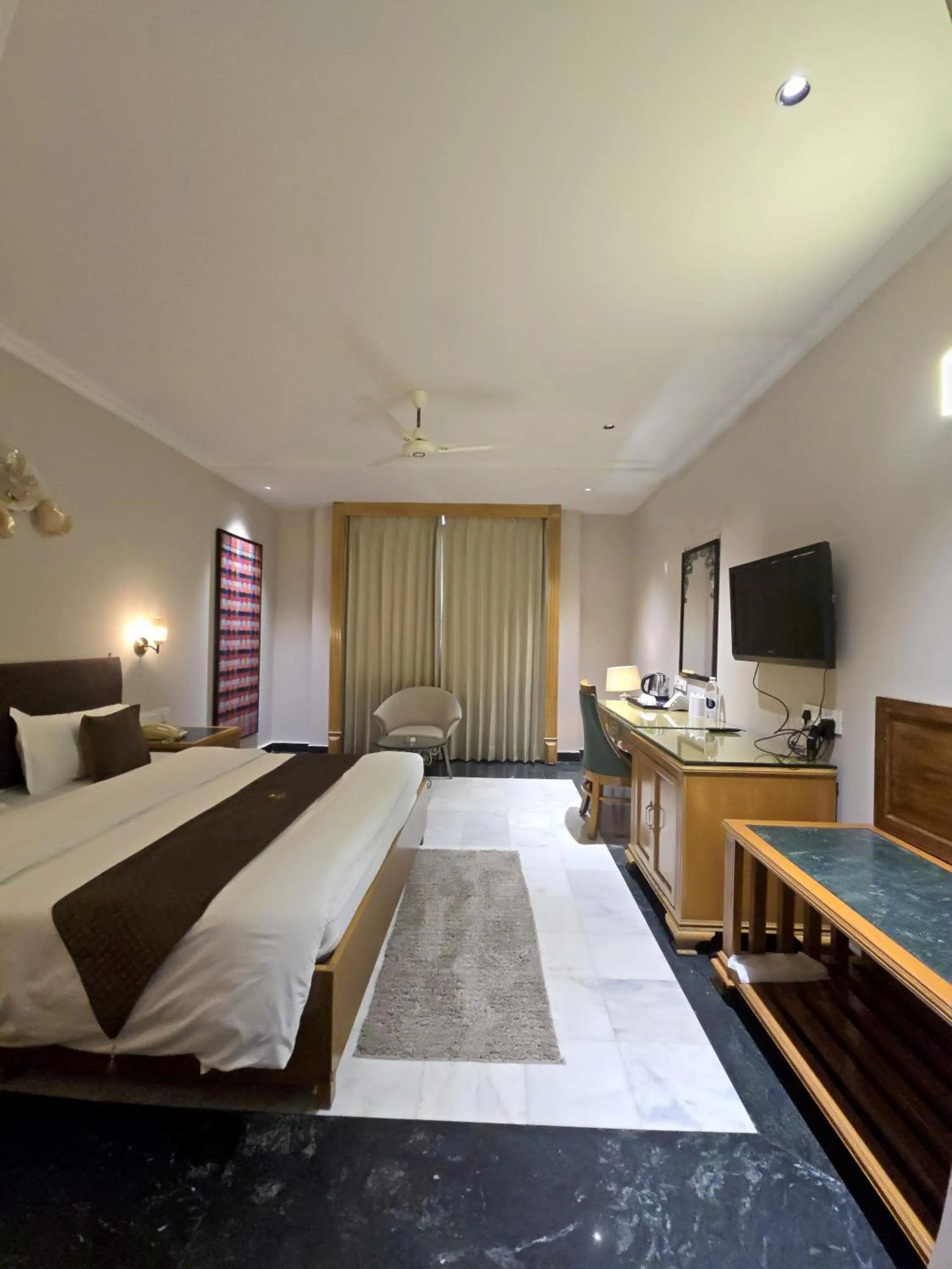 Communal lounge/ TV room, Bed in Hotel Supreme Suites I B2B Friendly I Ludhiana