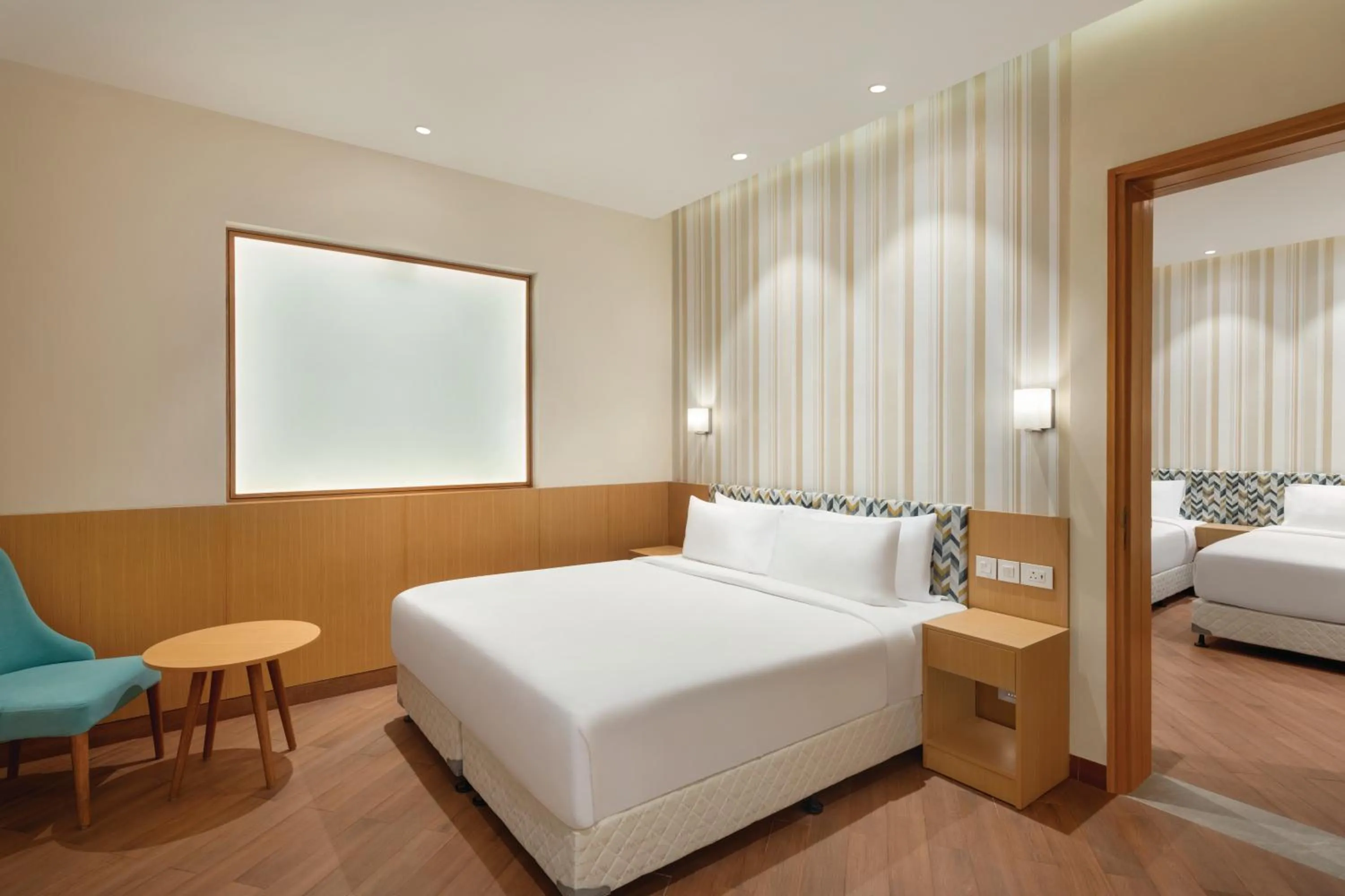 Bed in Ramada Encore by Wyndham Lucknow Airport