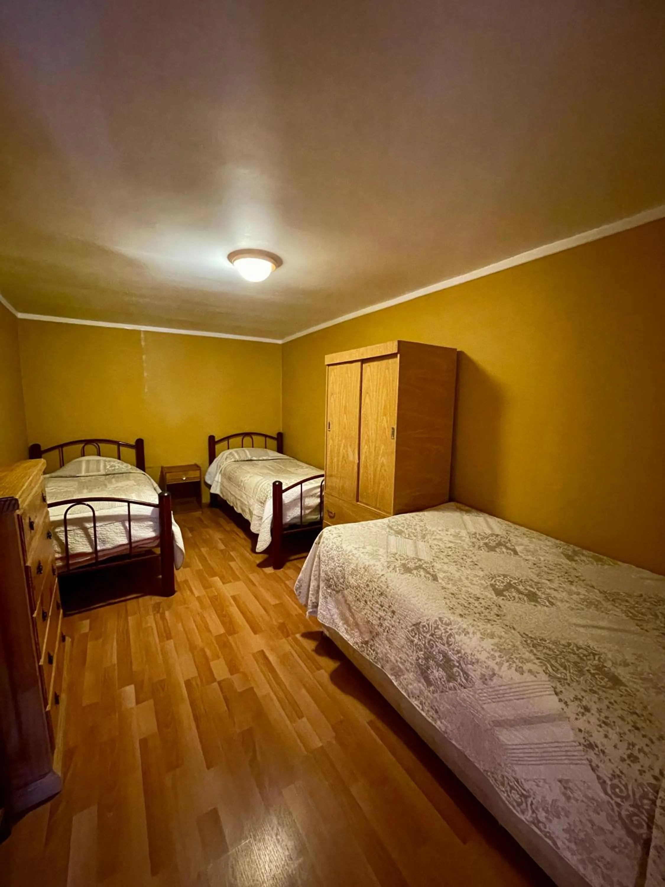 Basic Triple Room with Shared Bathroom in Hostal Corvatsch Chile