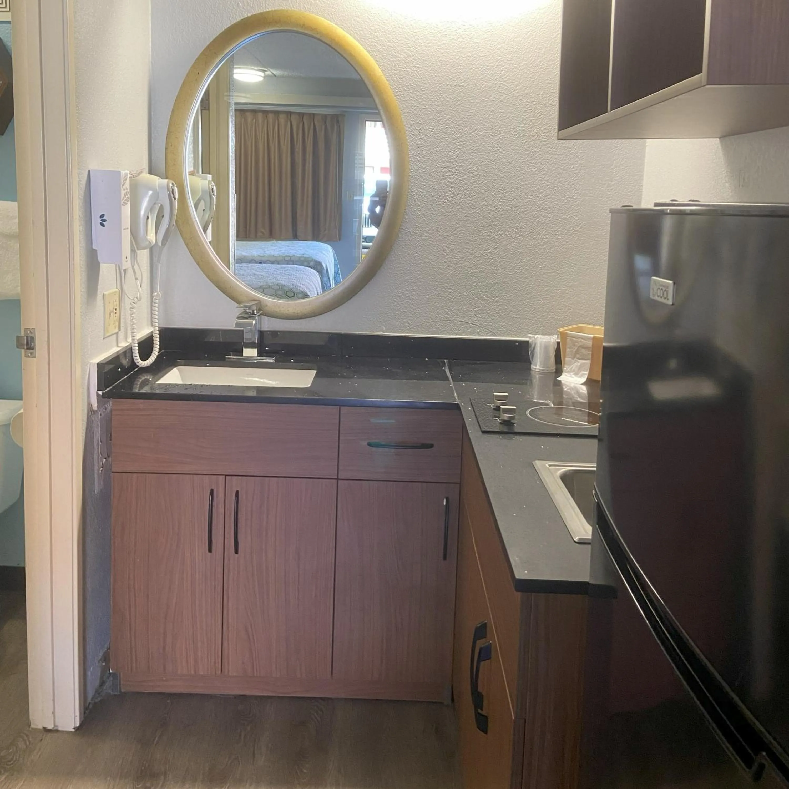 kitchen in HomeTowne Studios by Red Roof Buffalo - Niagara Airport