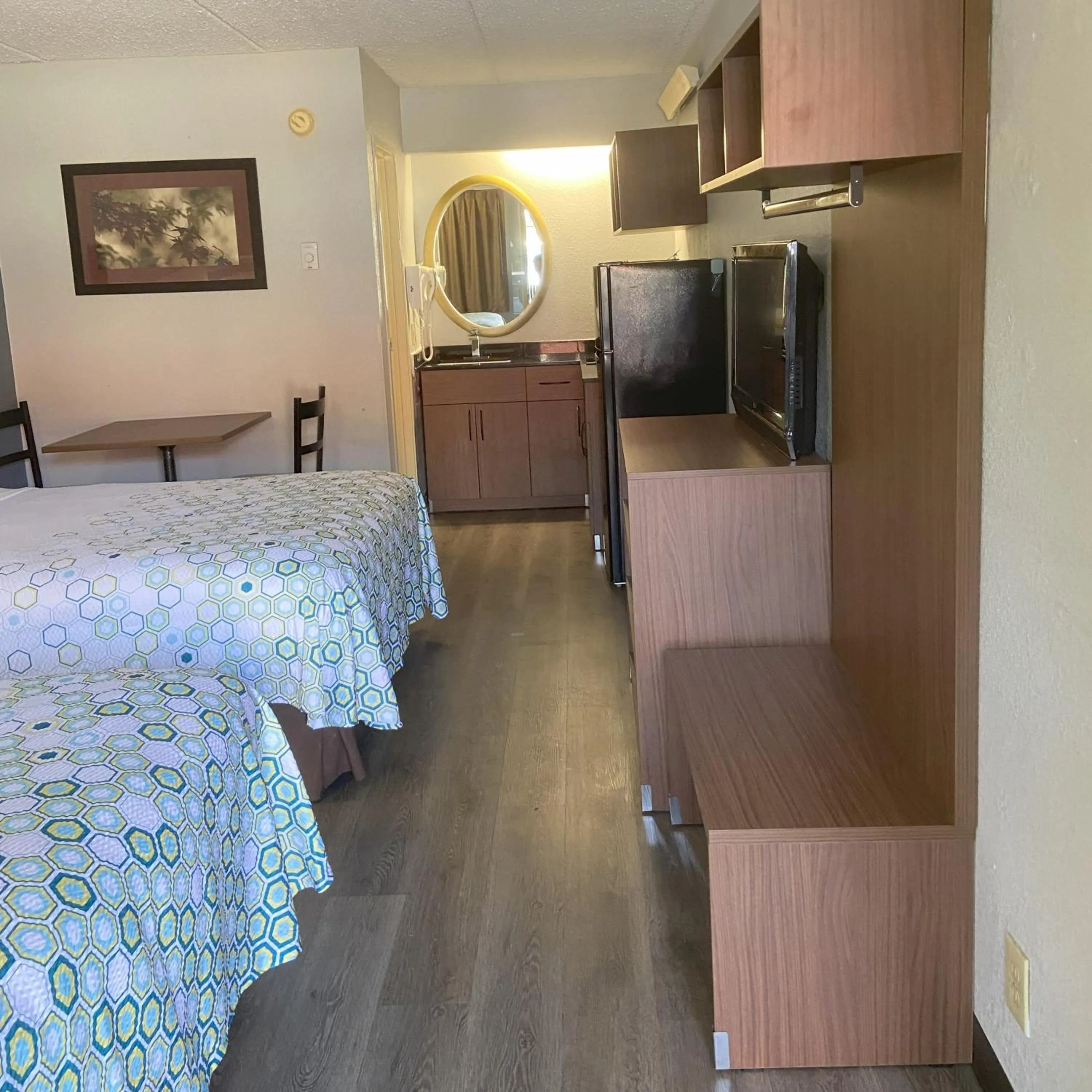 Bedroom, Bed in HomeTowne Studios by Red Roof Buffalo - Niagara Airport