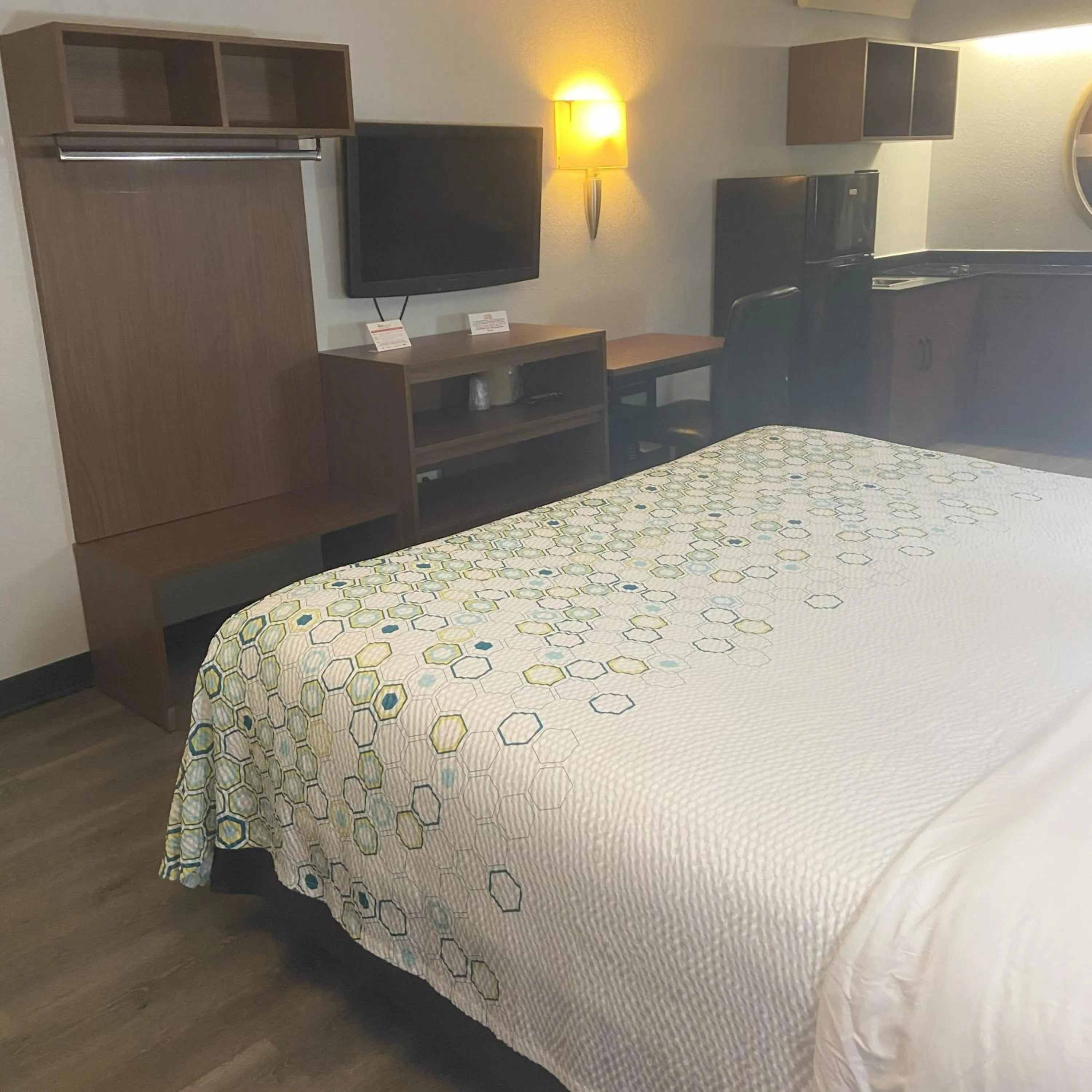 Bedroom, Bed in HomeTowne Studios by Red Roof Buffalo - Niagara Airport