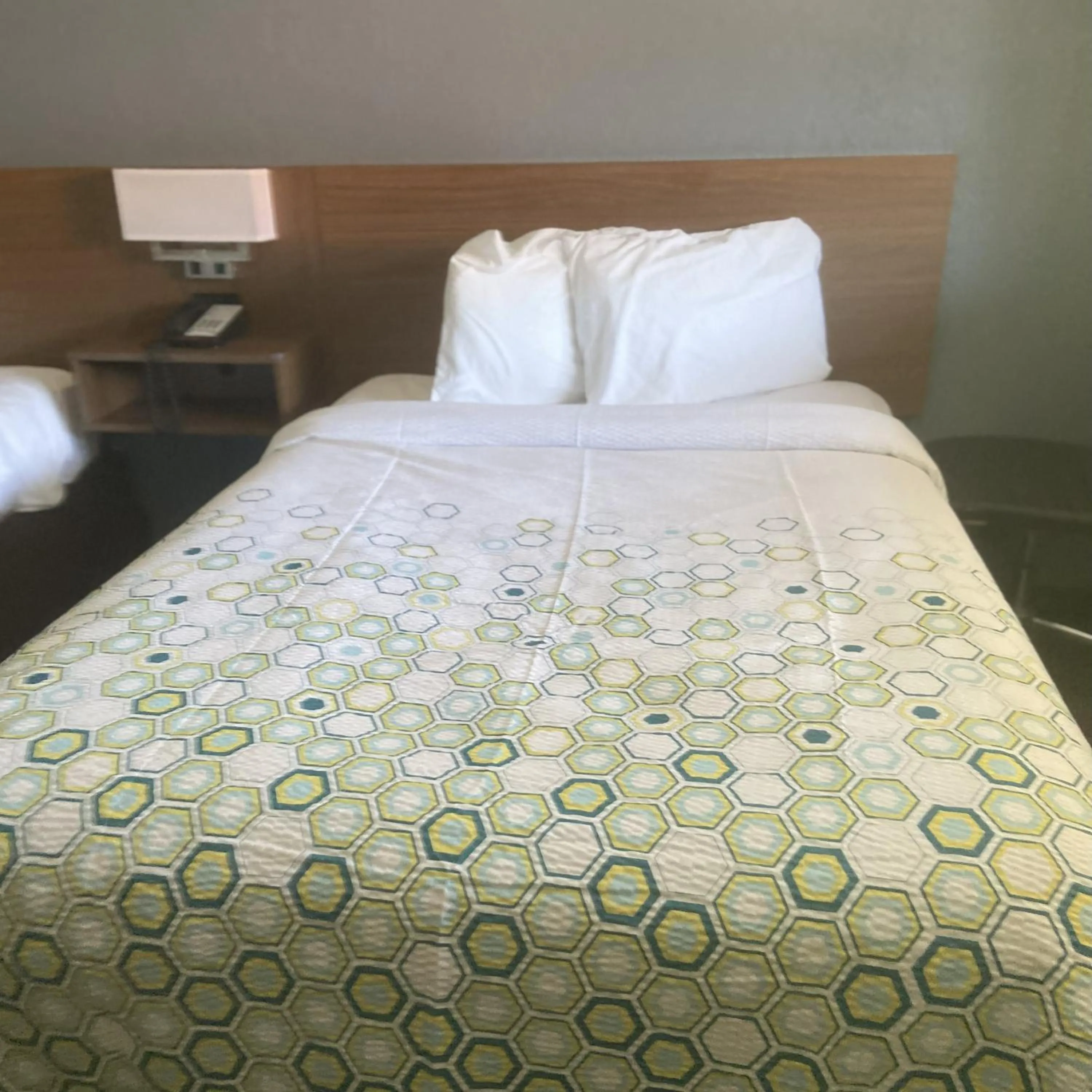 Bed in HomeTowne Studios by Red Roof Buffalo - Niagara Airport