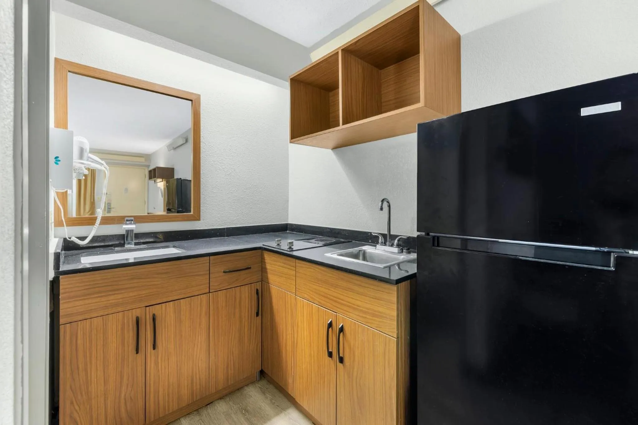 Kitchen or kitchenette in HomeTowne Studios by Red Roof Buffalo - Niagara Airport