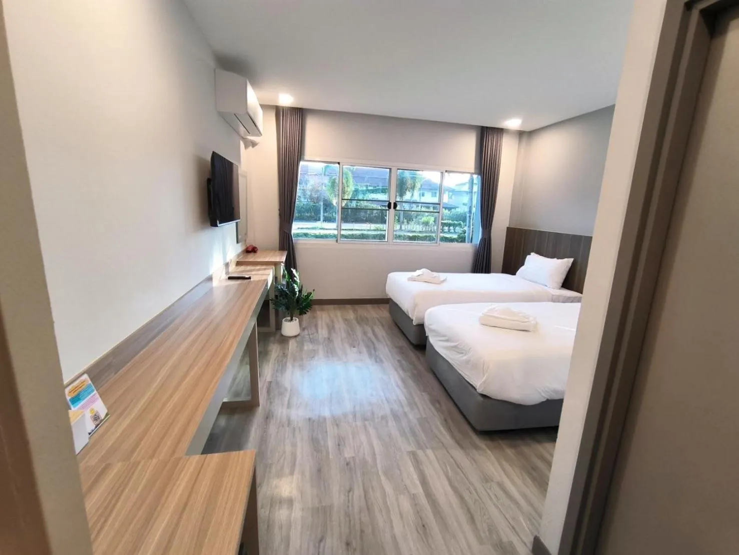 Bed in The Space Airport Hotel Chiang Rai