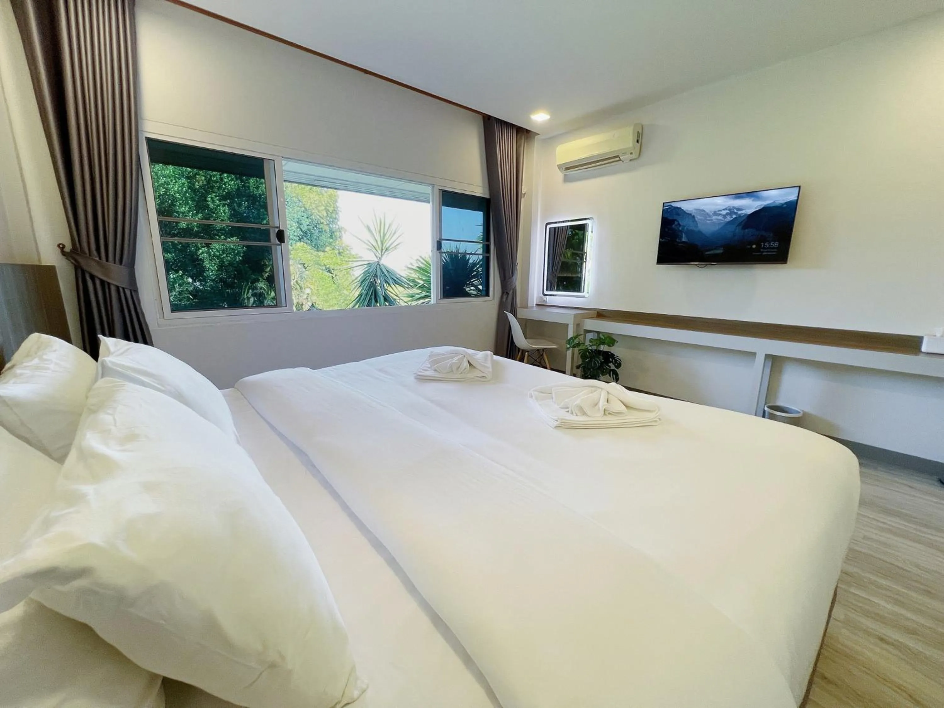 Bed in The Space Airport Hotel Chiang Rai