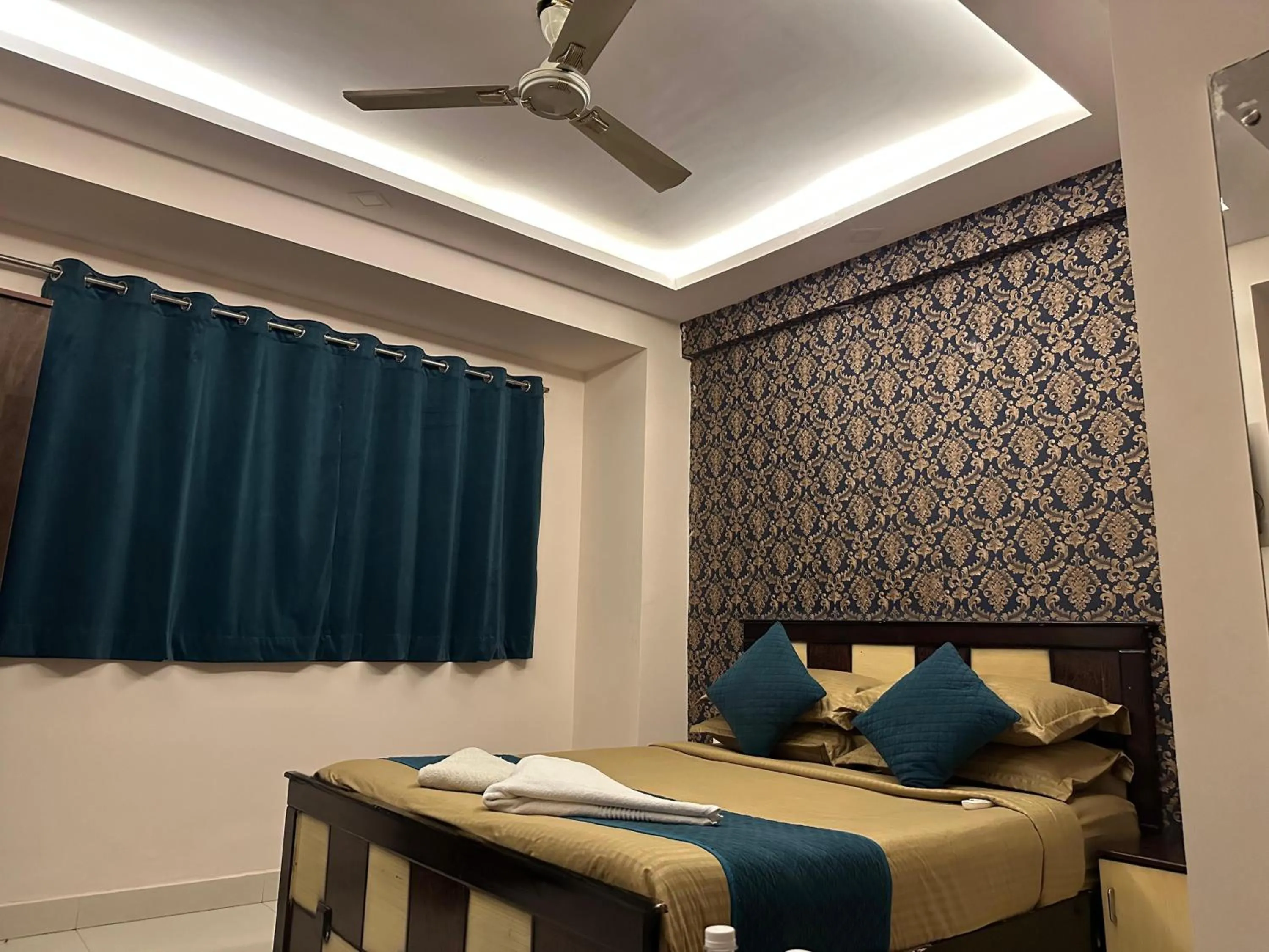 Bed in Blue Bliss Suites By PPH Living
