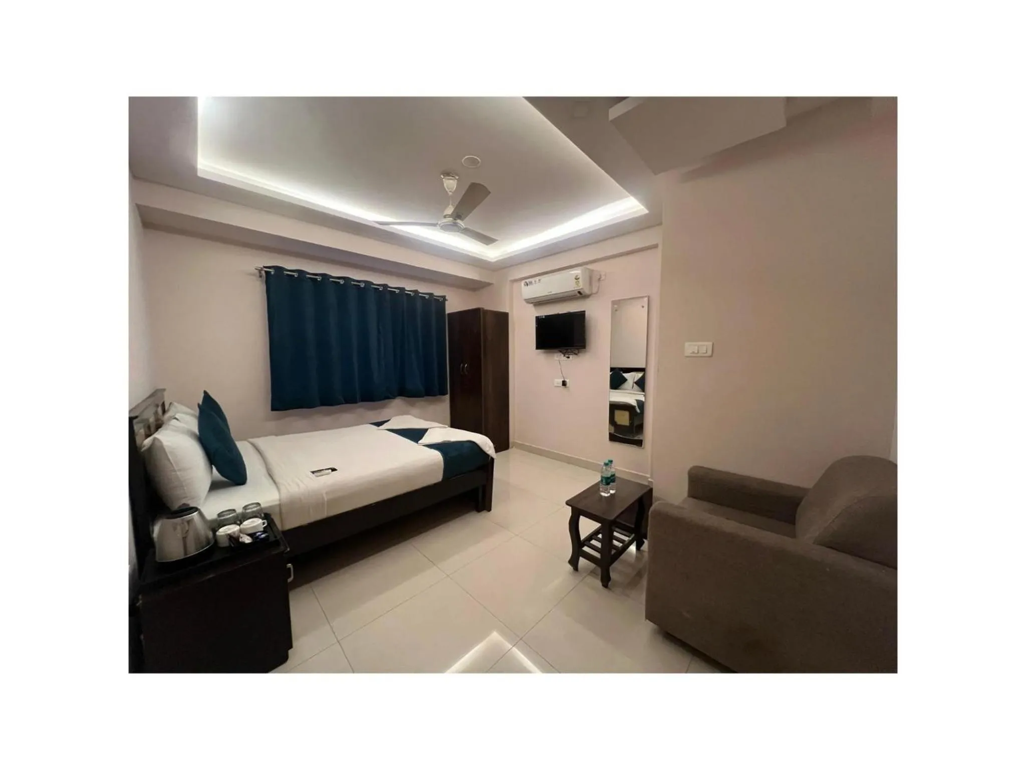 Bed in Blue Bliss Suites By PPH Living