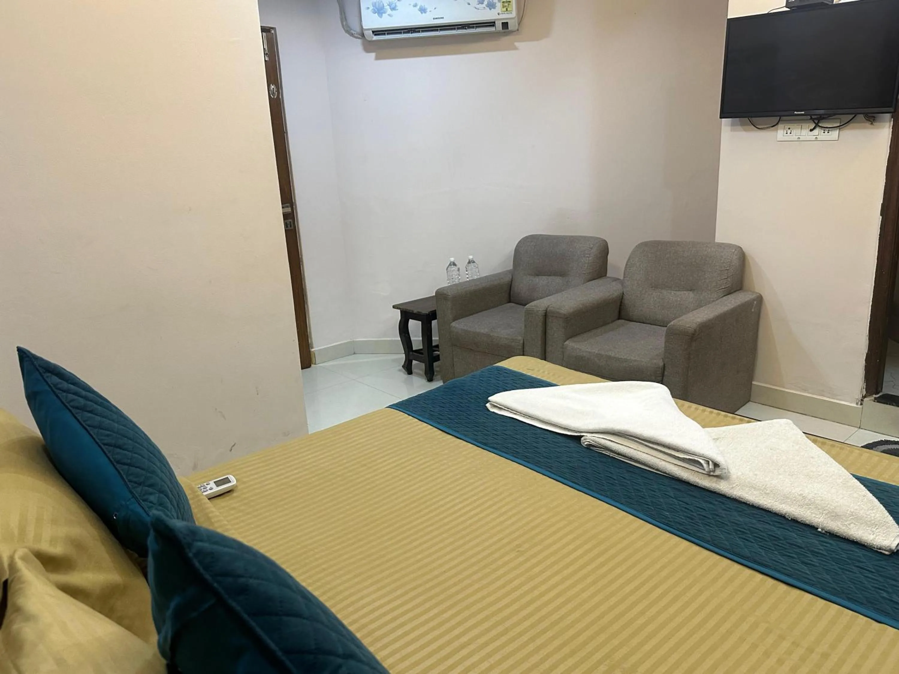 Bed in Blue Bliss Suites By PPH Living