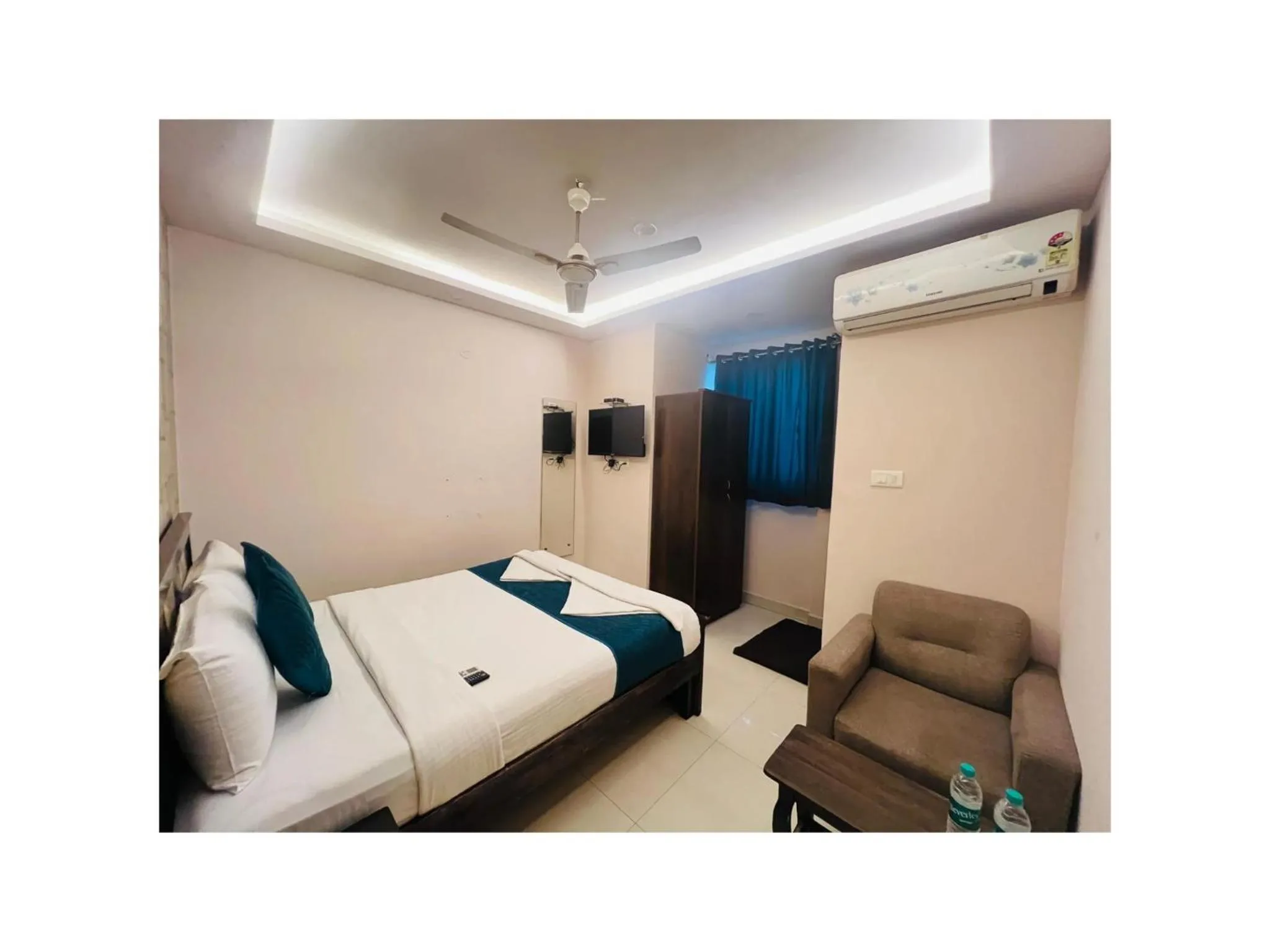 Bed in Blue Bliss Suites By PPH Living