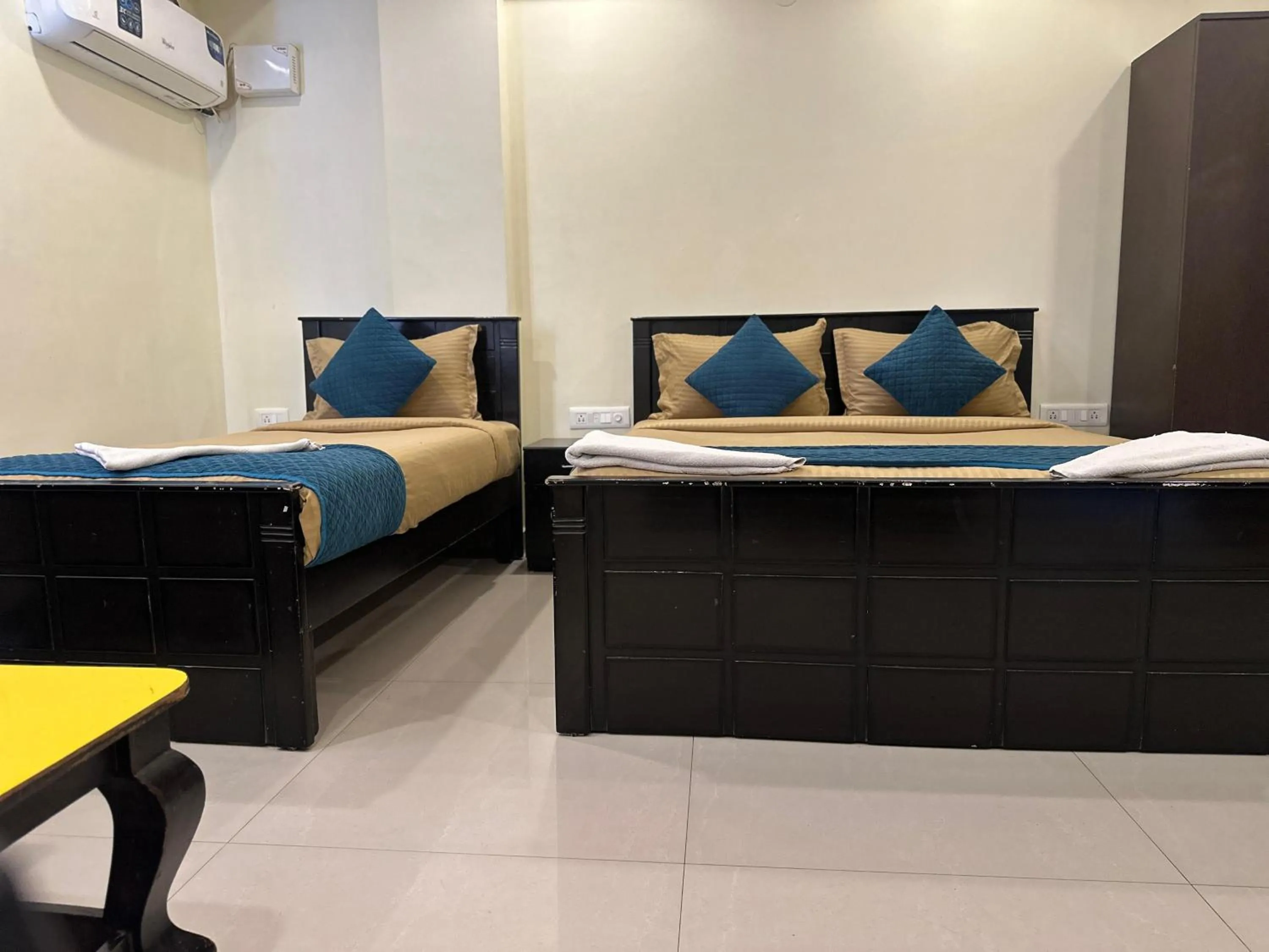 Bed in Blue Bliss Suites By PPH Living