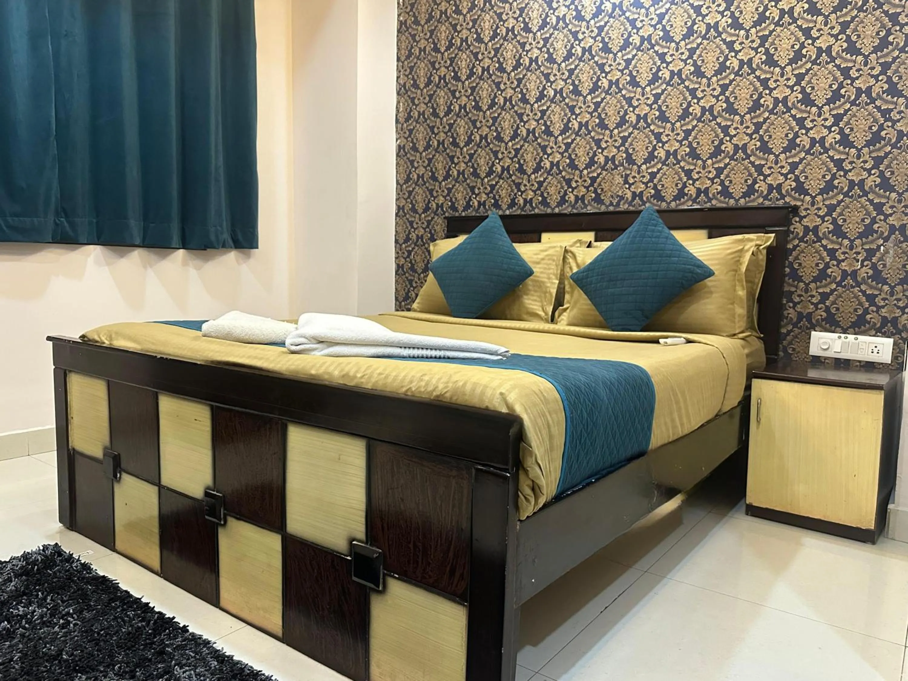 Bed in Blue Bliss Suites By PPH Living