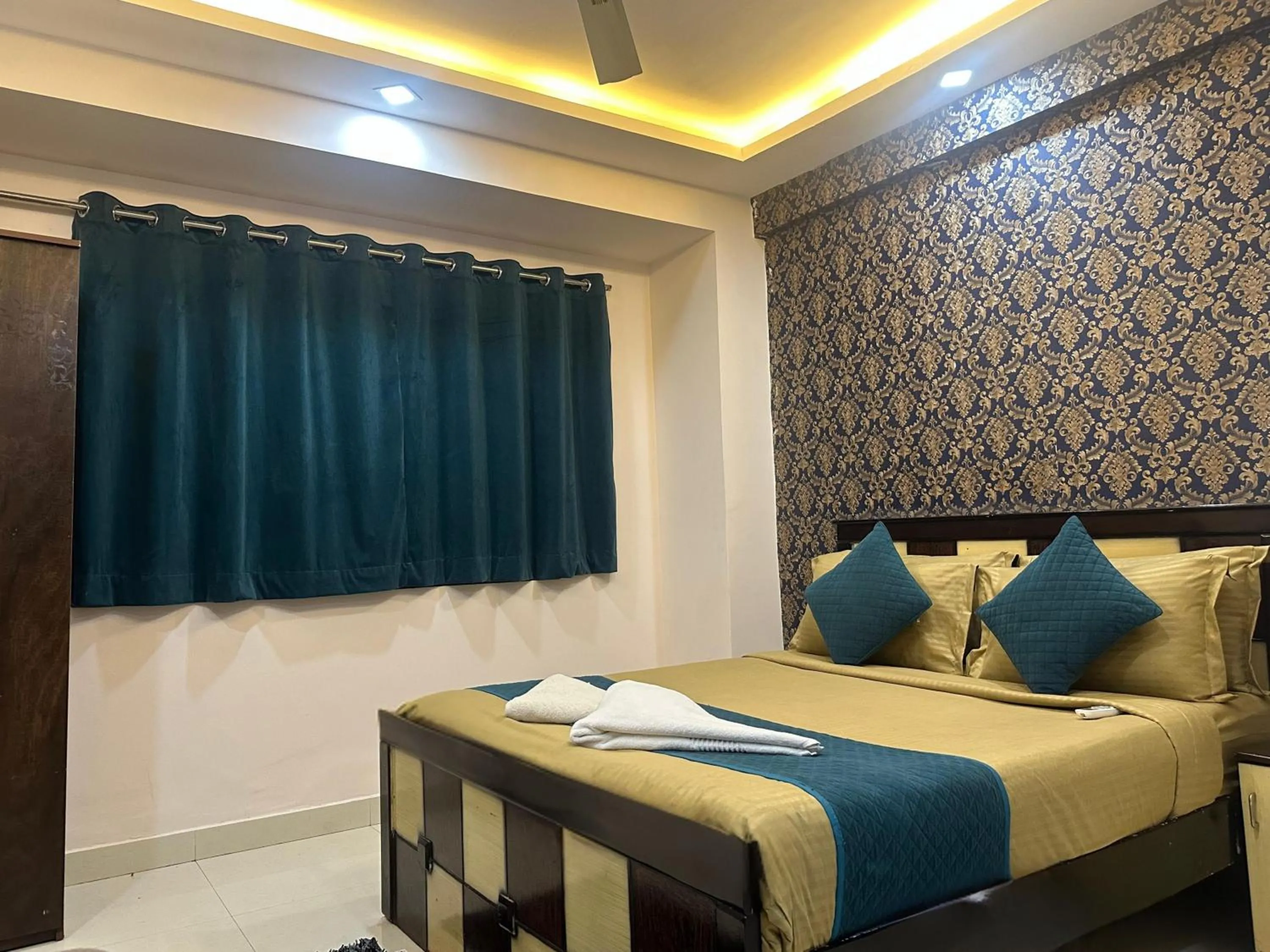 Bed in Blue Bliss Suites By PPH Living