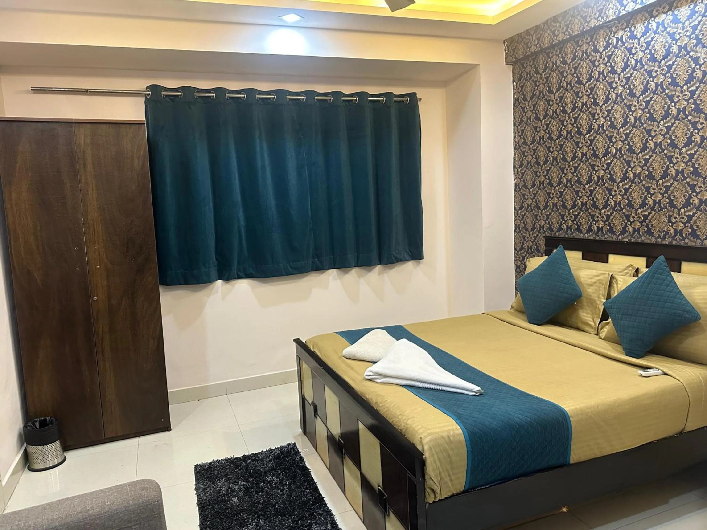 Bed in Blue Bliss Suites By PPH Living