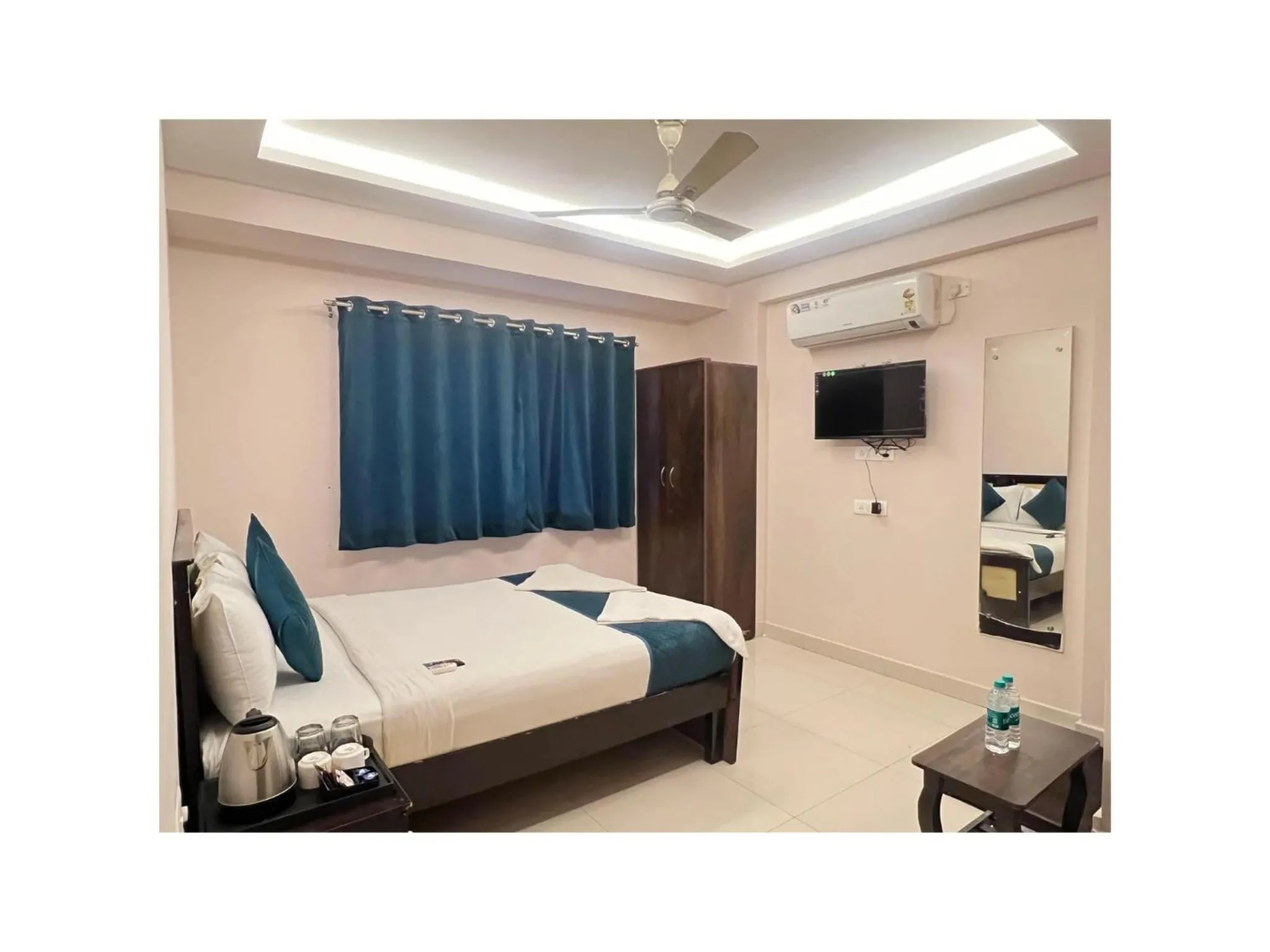Bed in Blue Bliss Suites By PPH Living