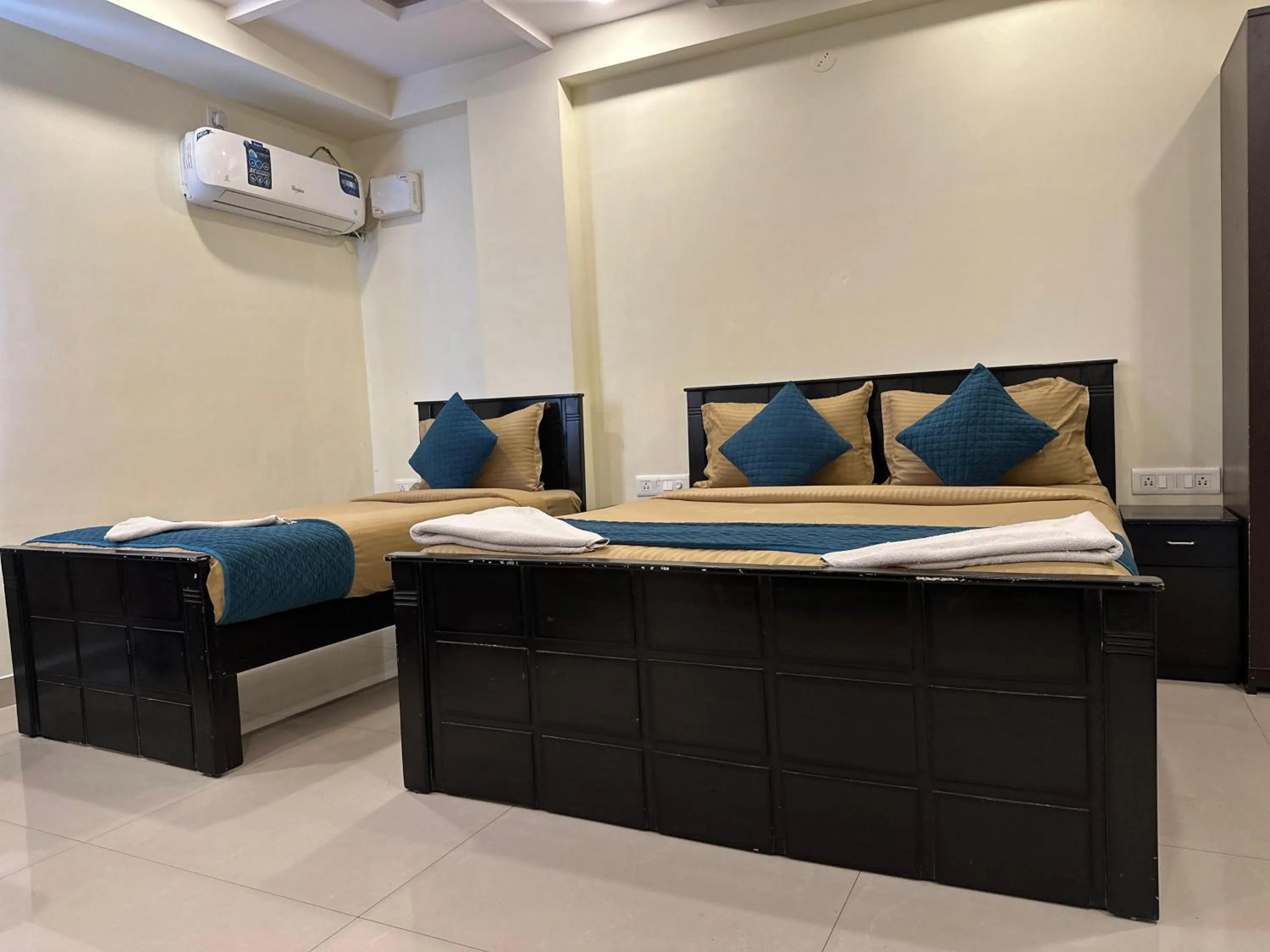 Bed in Blue Bliss Suites By PPH Living