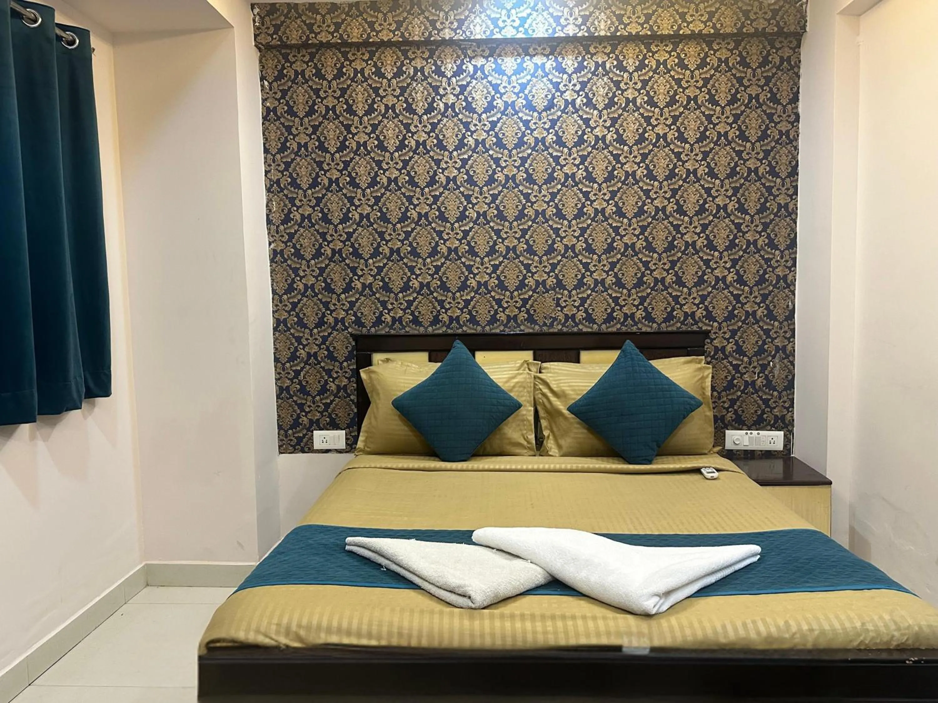 Bed in Blue Bliss Suites By PPH Living