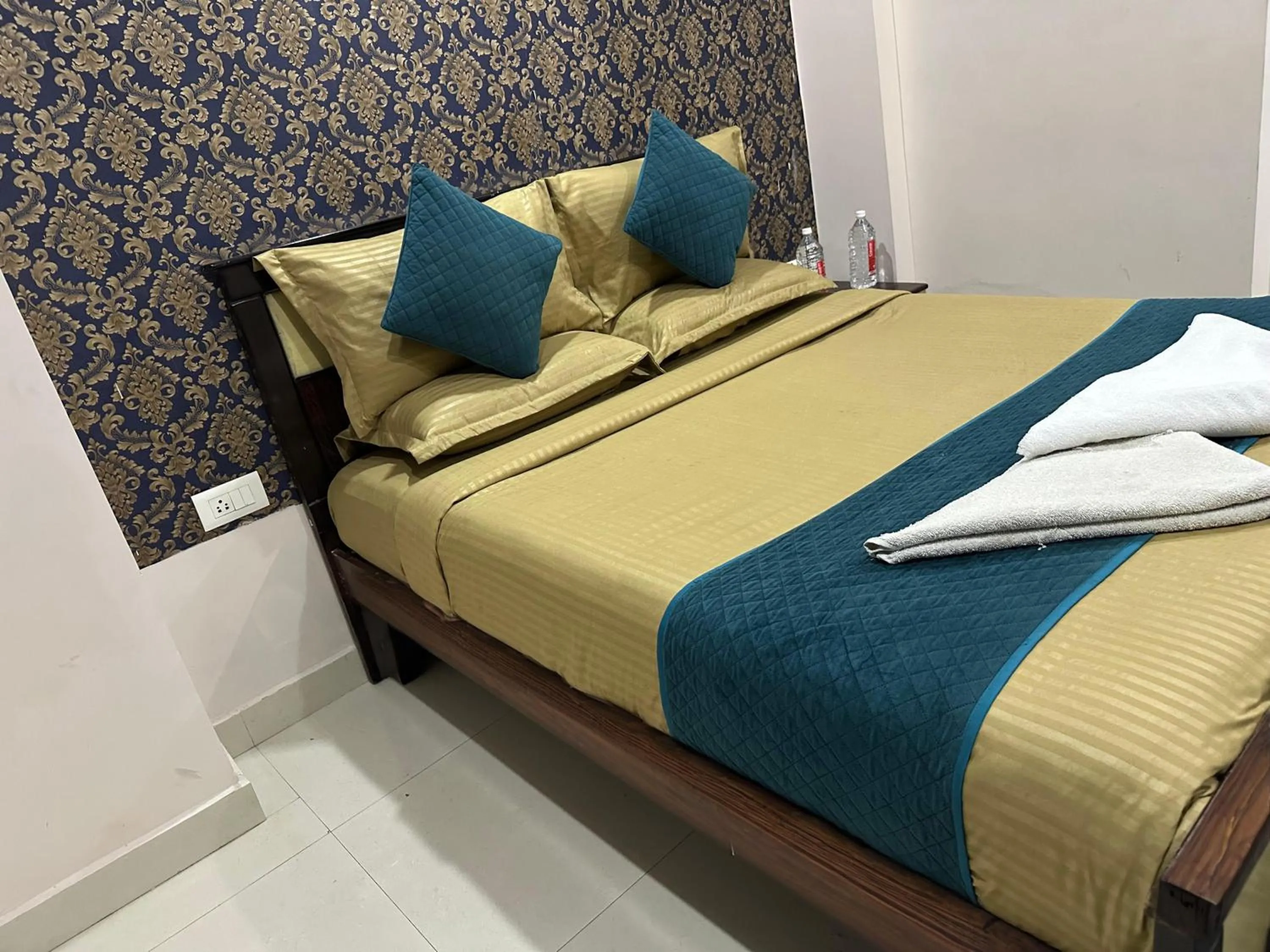 Bed in Blue Bliss Suites By PPH Living