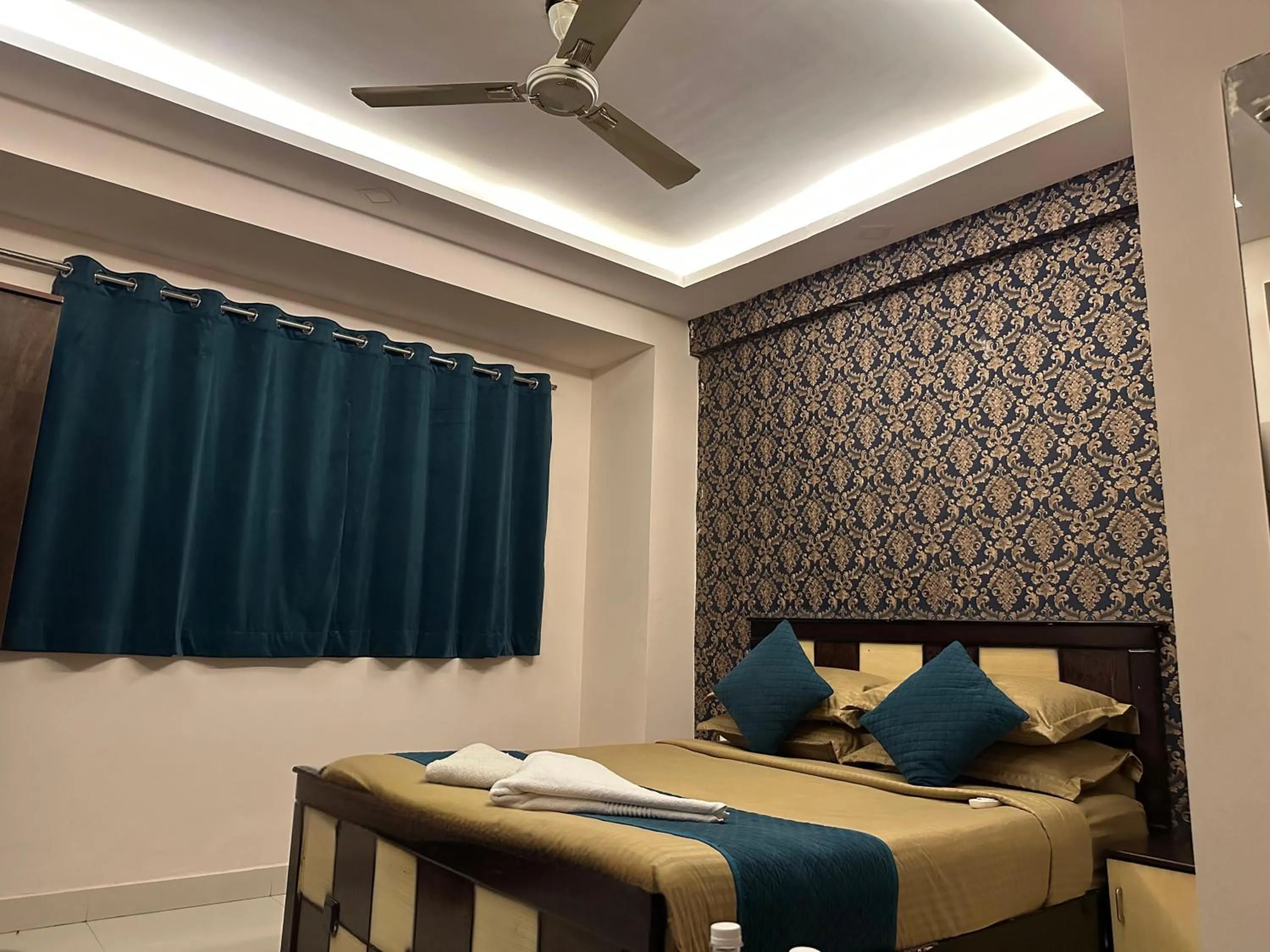 Bed in Blue Bliss Suites By PPH Living