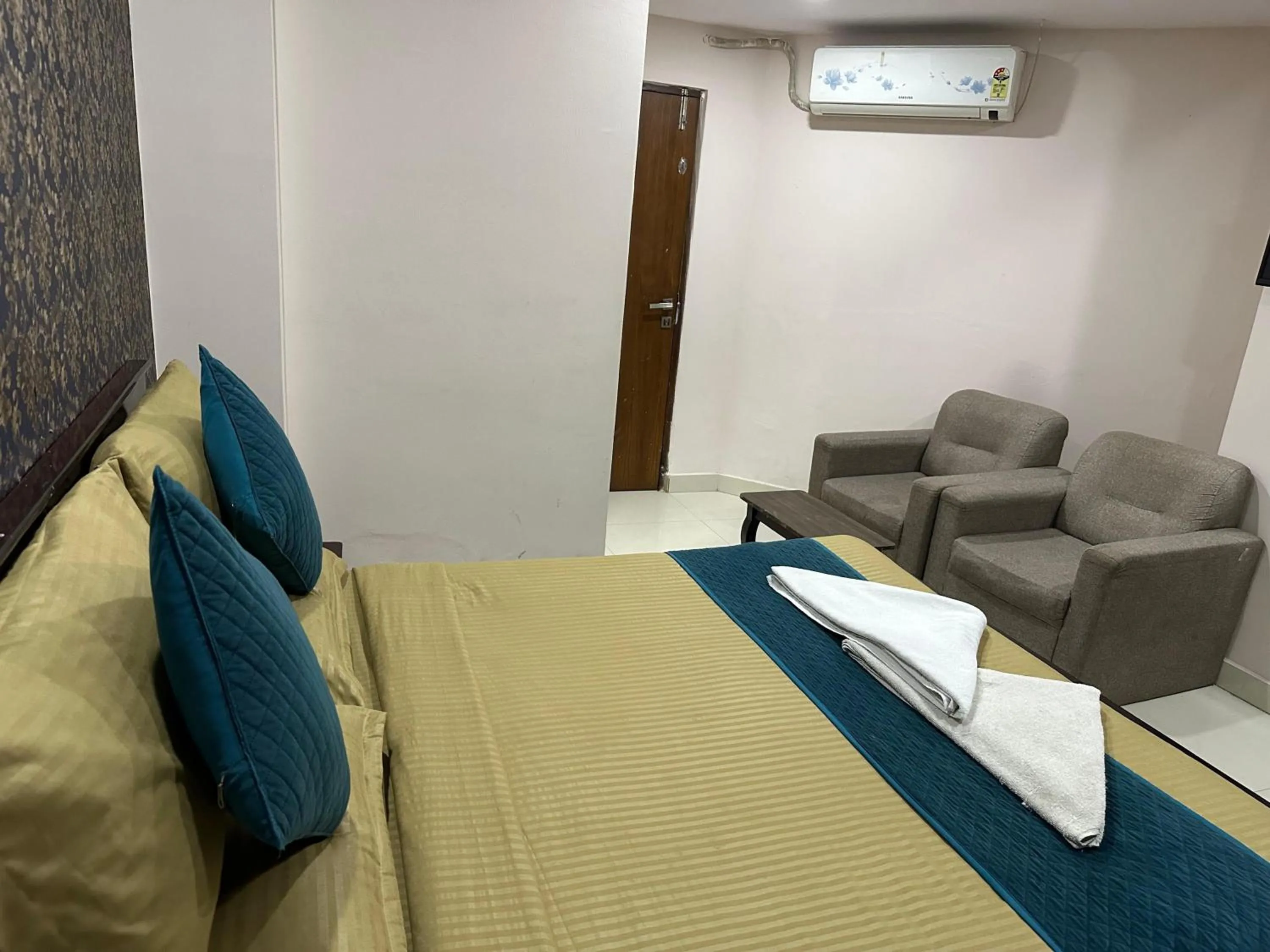 Bed in Blue Bliss Suites By PPH Living