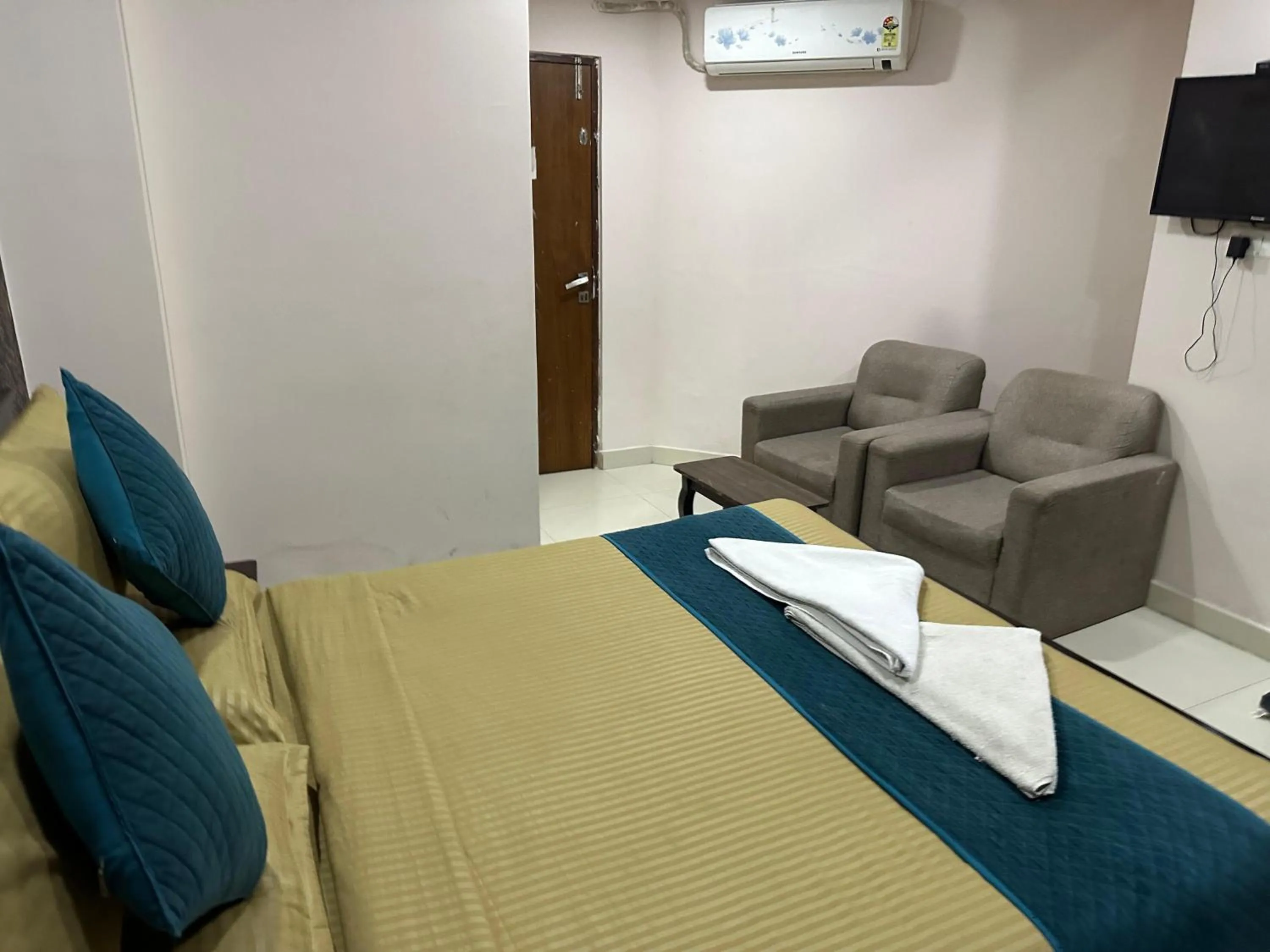 Bed in Blue Bliss Suites By PPH Living