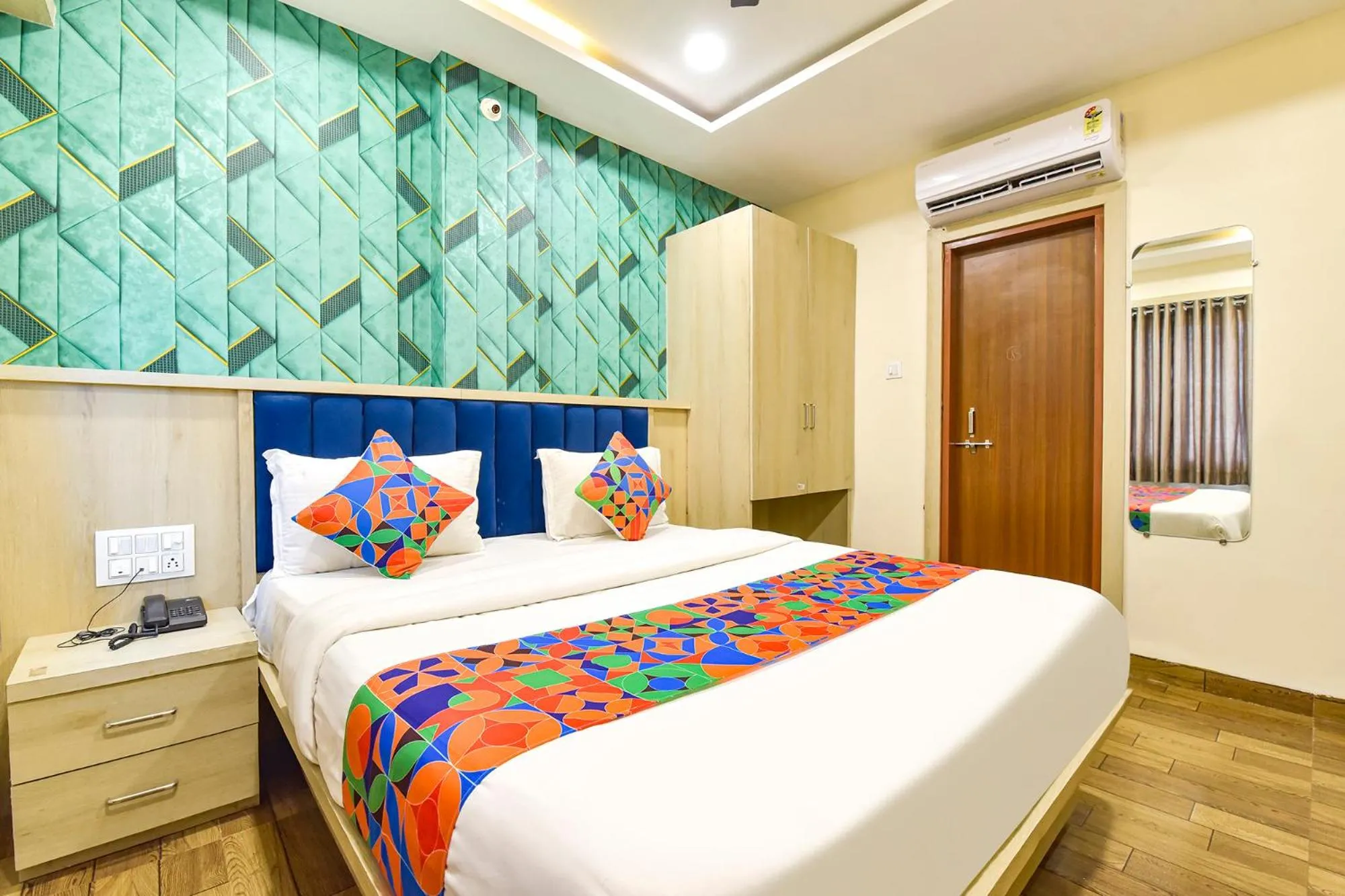Bed in FabHotel Bhavna Palace