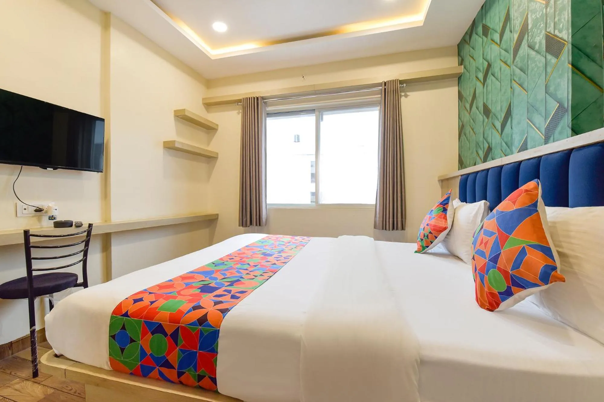 Bed in FabHotel Bhavna Palace