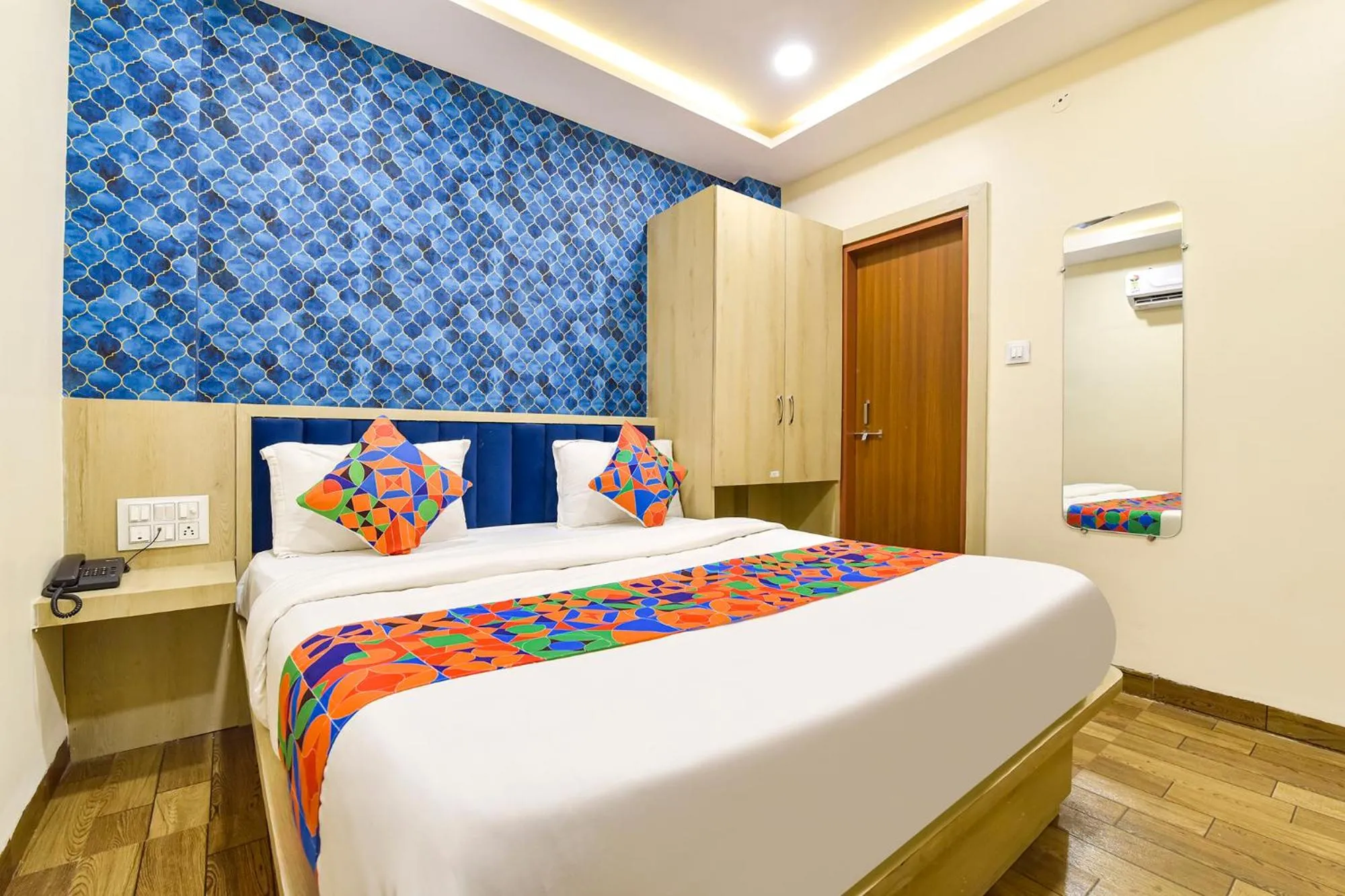 Bed in FabHotel Bhavna Palace