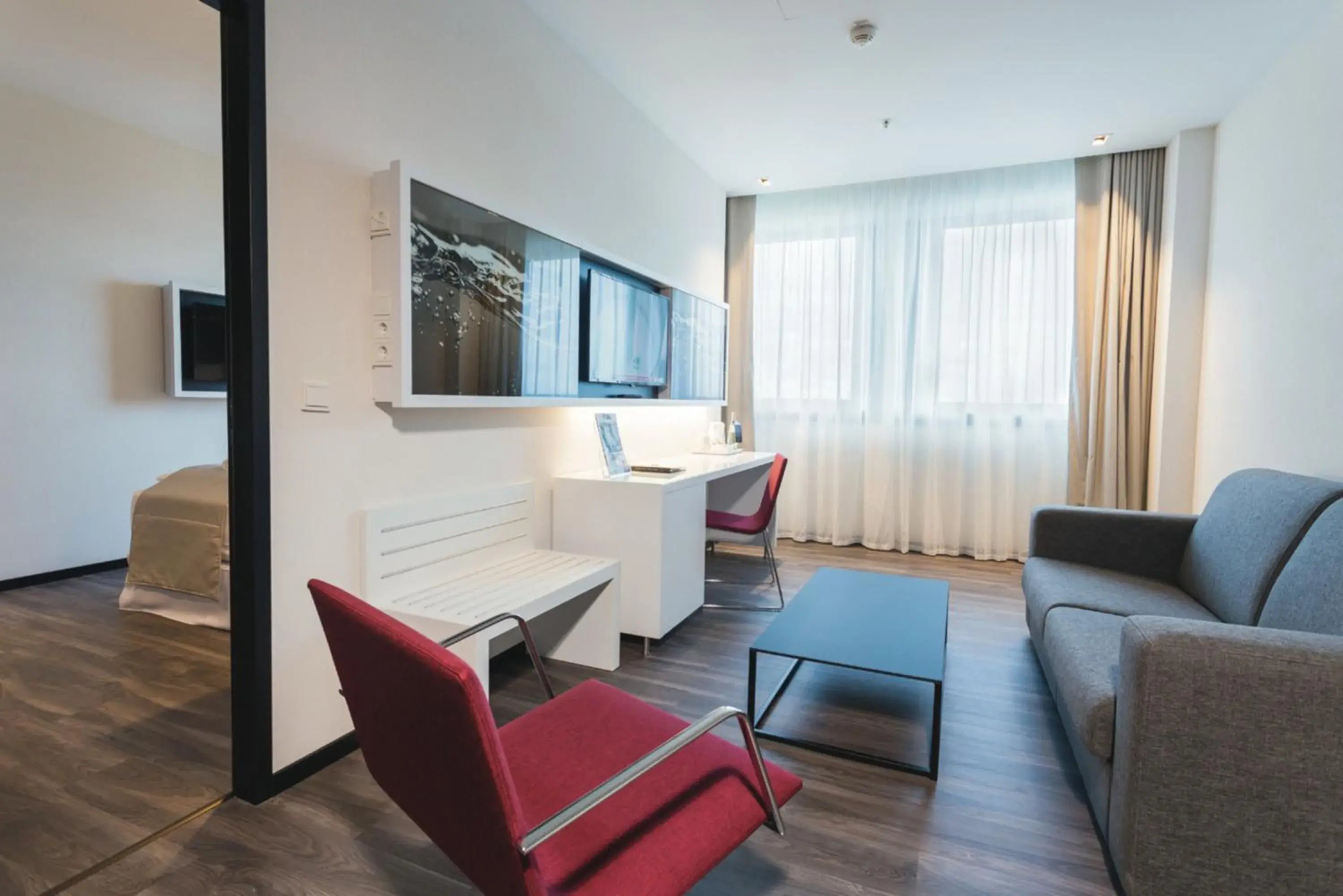 Living room, Bed in Riu Plaza Berlin Living room, Bed in Riu Plaza Berlin