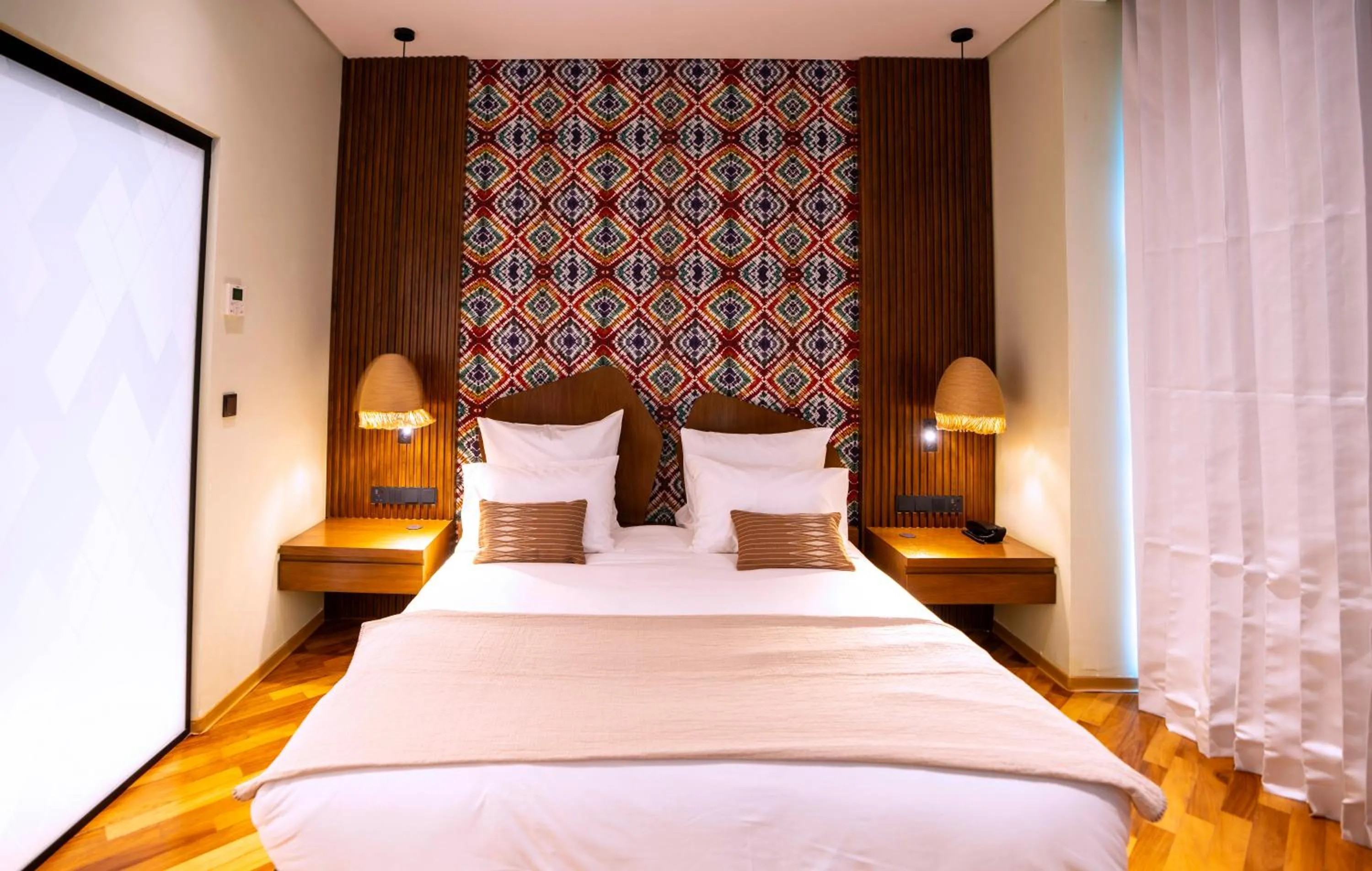 Bed in Onomo Allure Abuja AATC Hotel