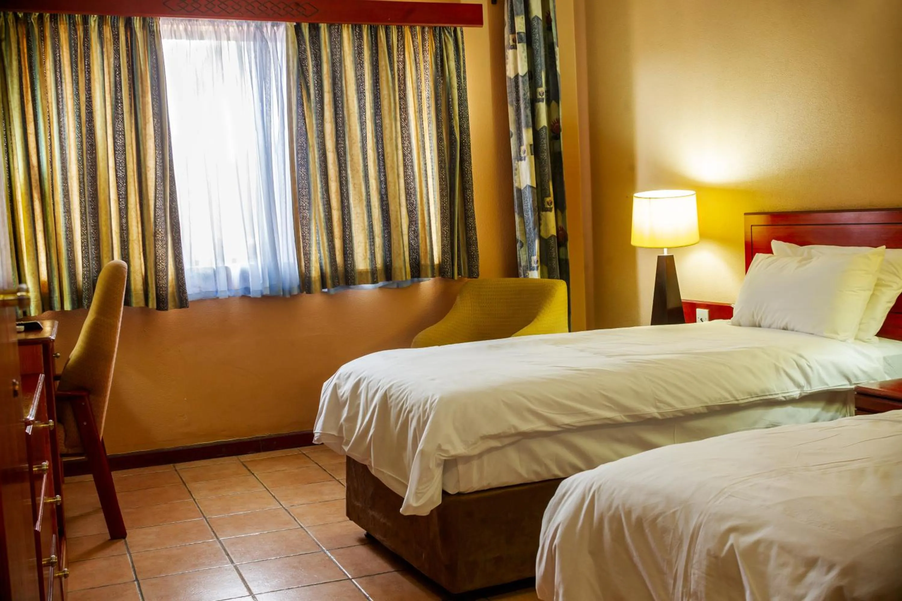 Bed in M'kango Golfview Hotel