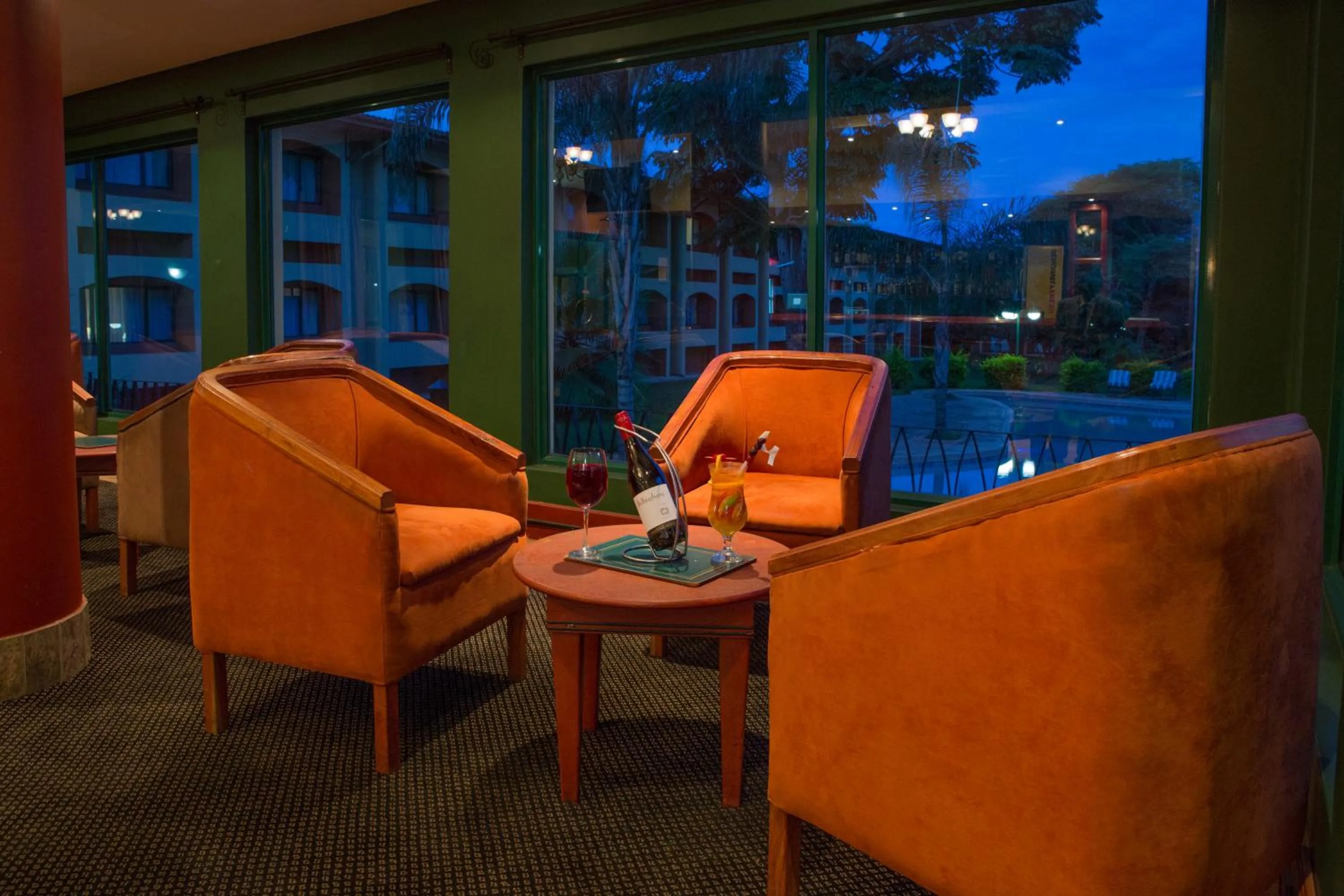 Communal lounge/ TV room in M'kango Golfview Hotel