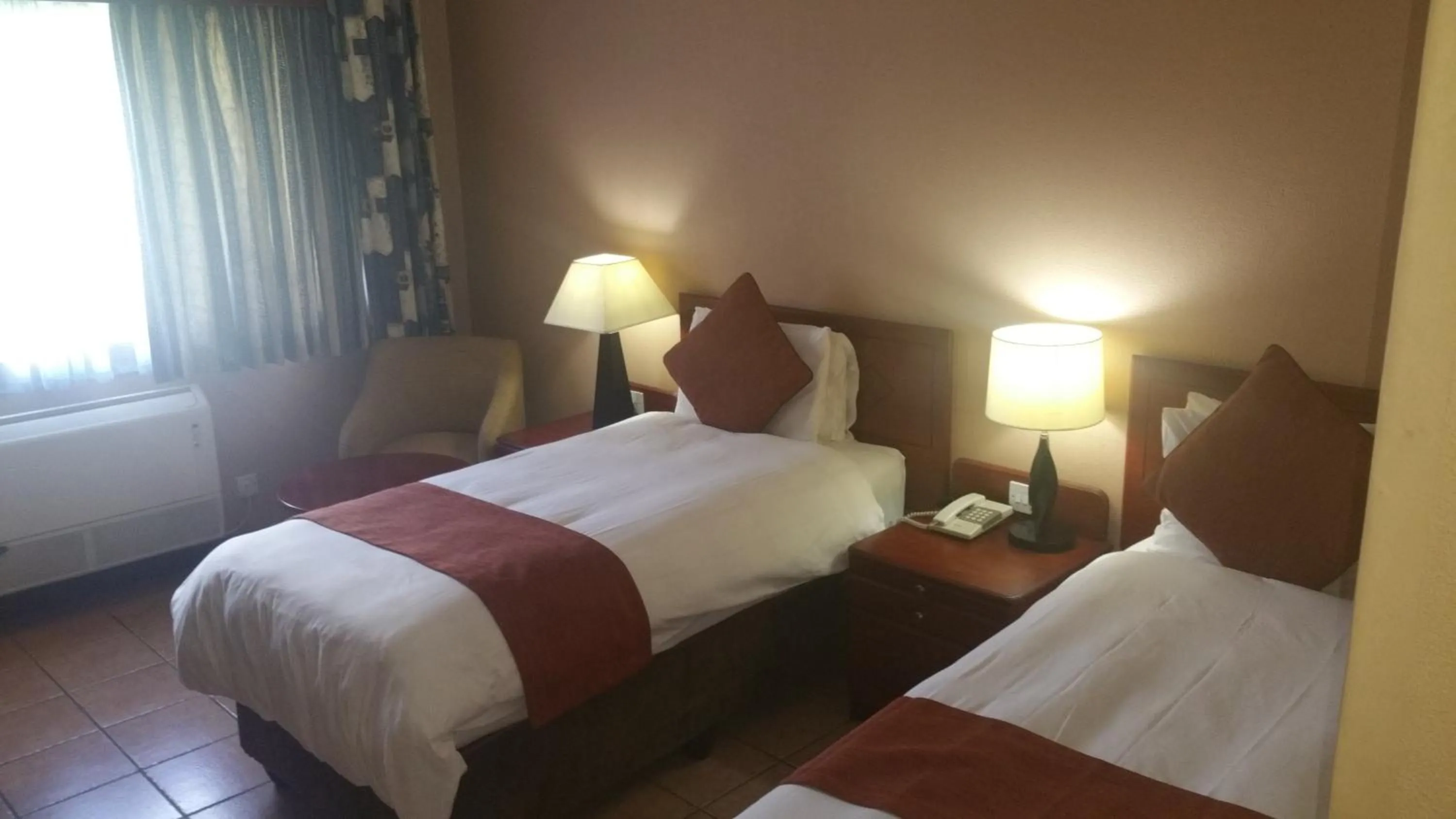 Bed in M'kango Golfview Hotel