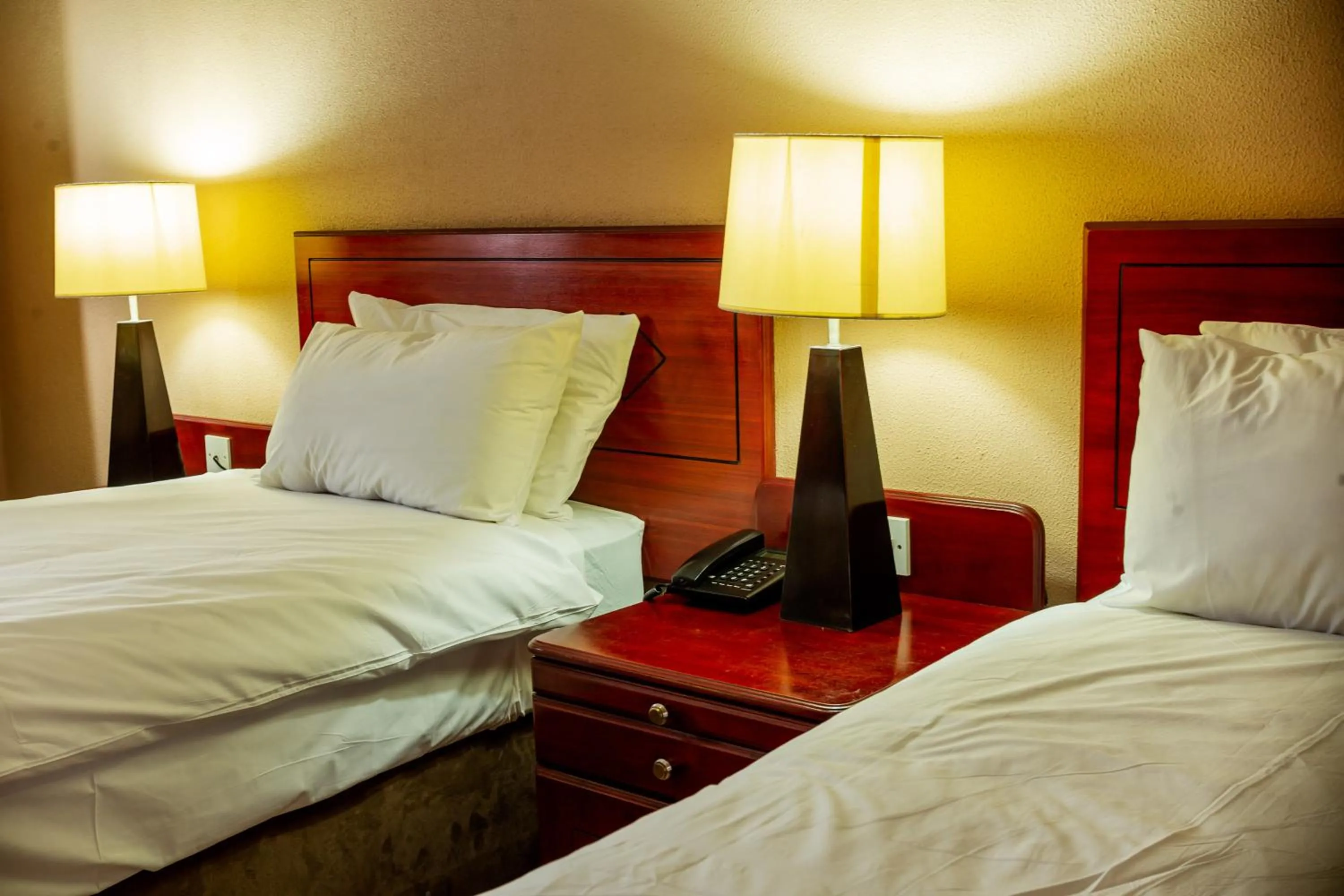 Bed in M'kango Golfview Hotel