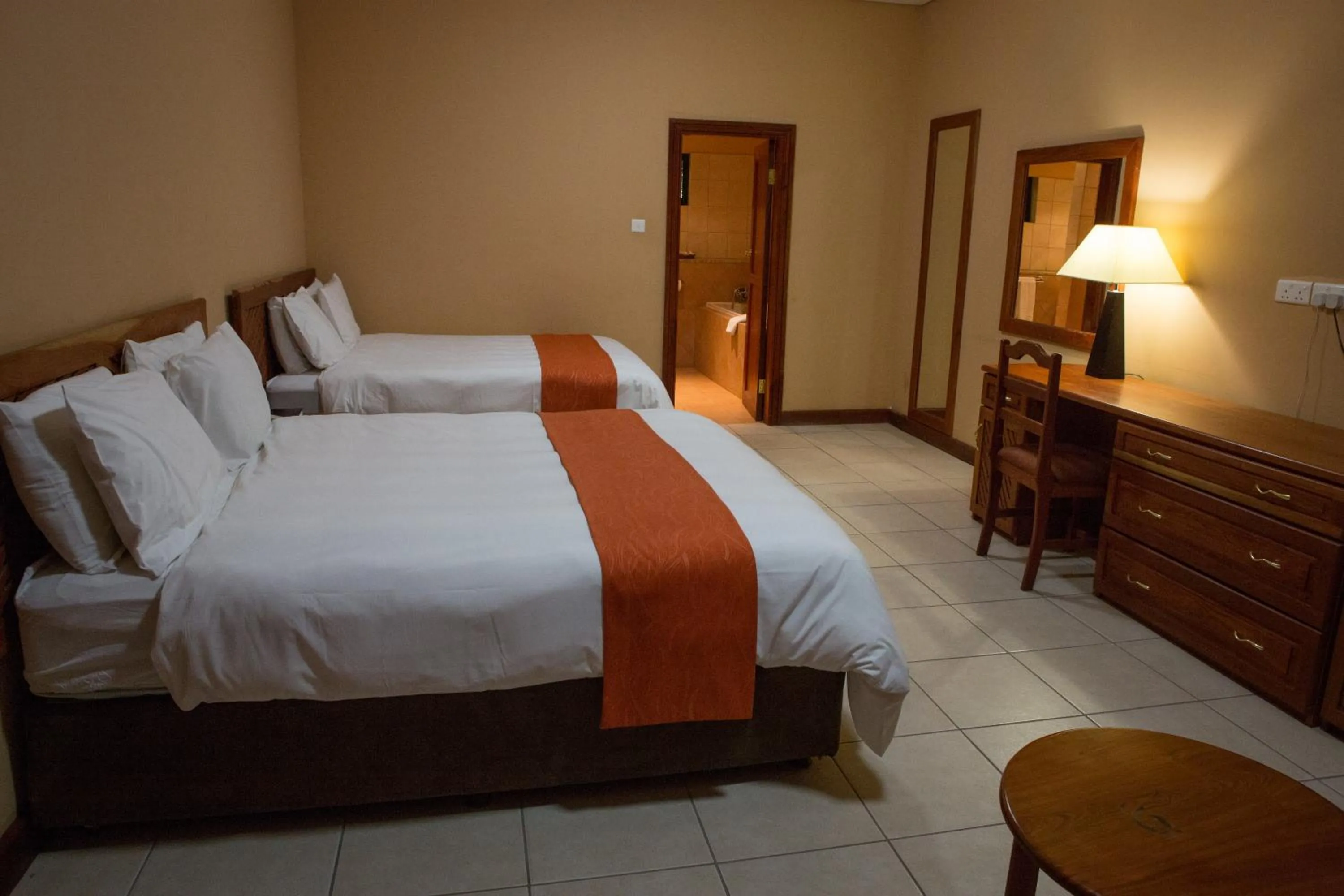 Photo of the whole room, Bed in M'kango Golfview Hotel