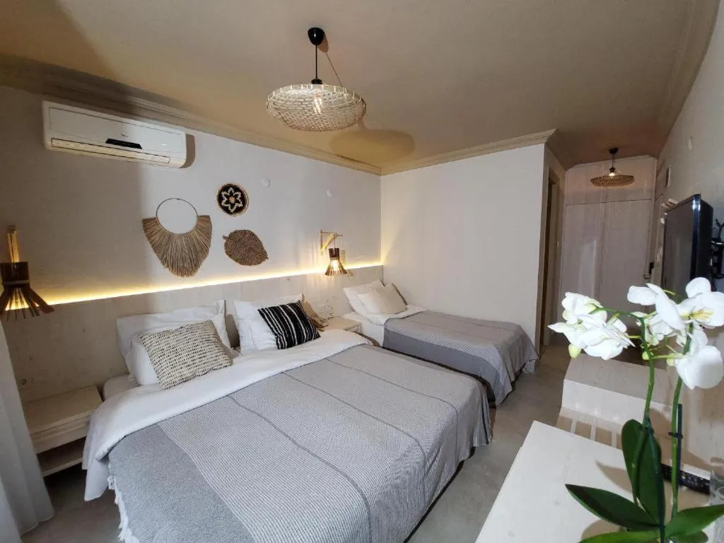 Bedroom, Bed in En Vie Beach Boutique Hotel - Adults Only