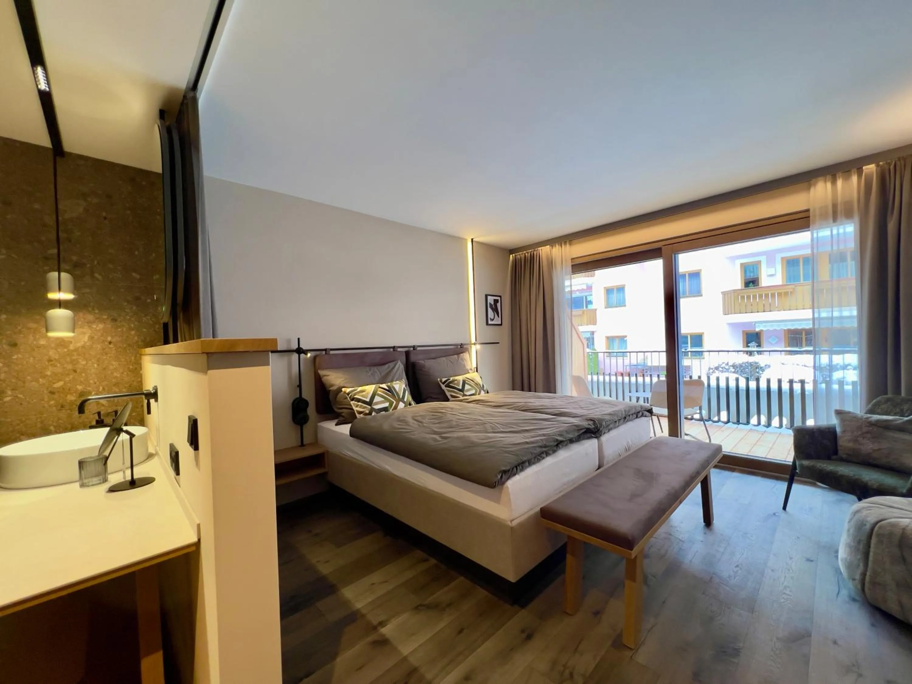 Photo of the whole room, Bed in Revier Boutique Hotel Kaprun