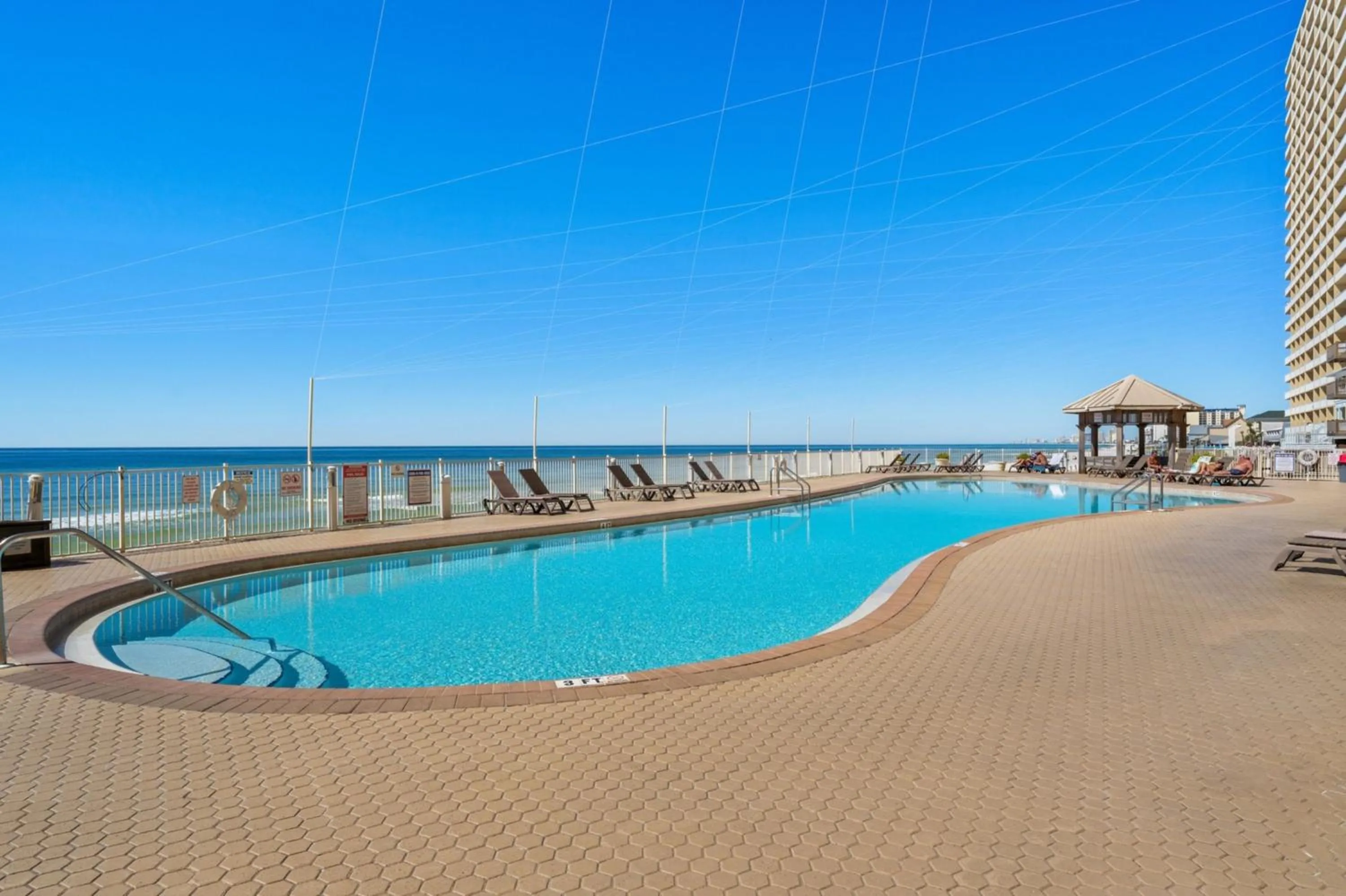 Property building in Treasure Shores–3BR Beachfront Corner Unit sleeps 8 with Stunning Gulf Views!