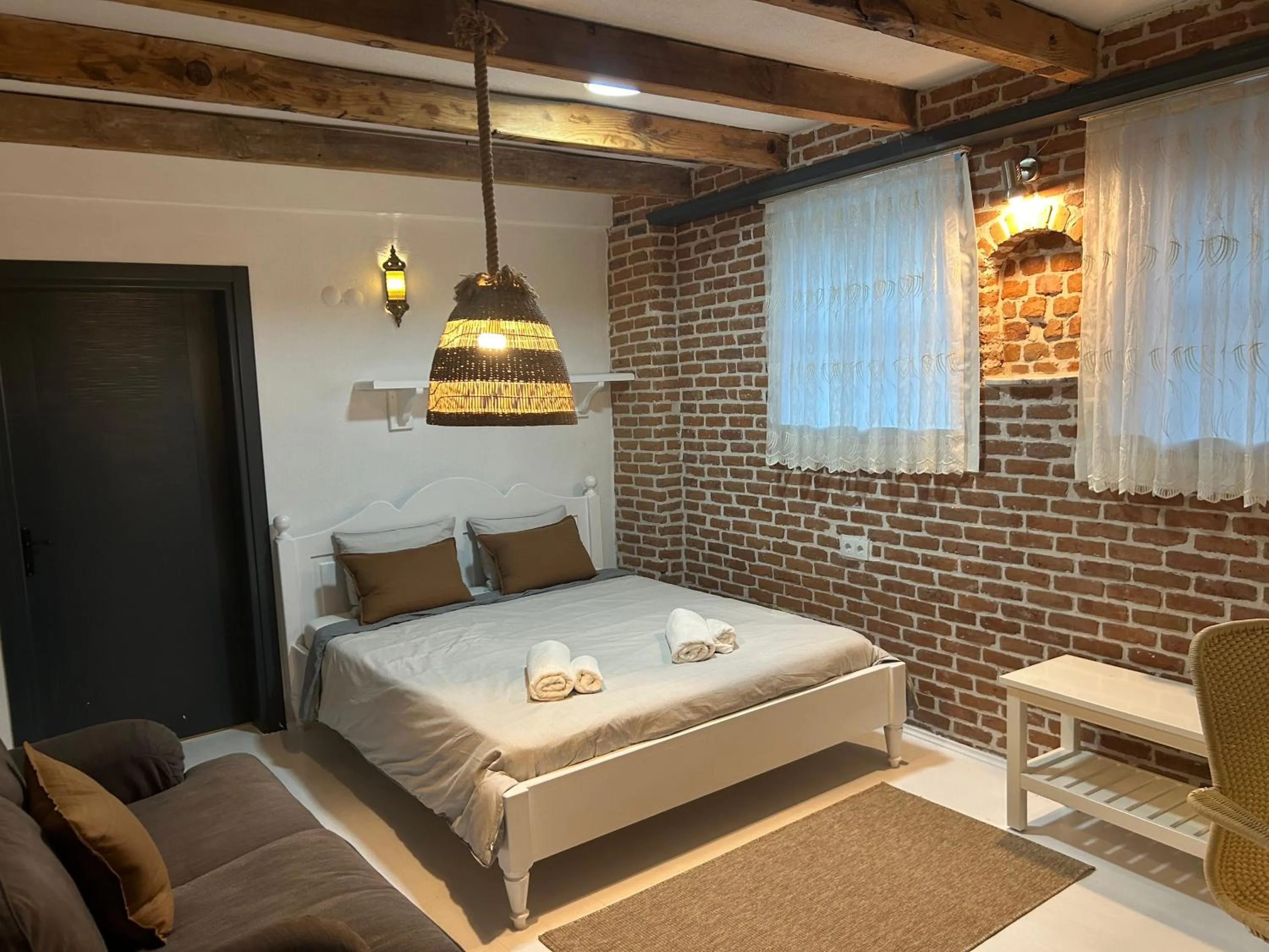 Bed in Attalos Suites Hotel