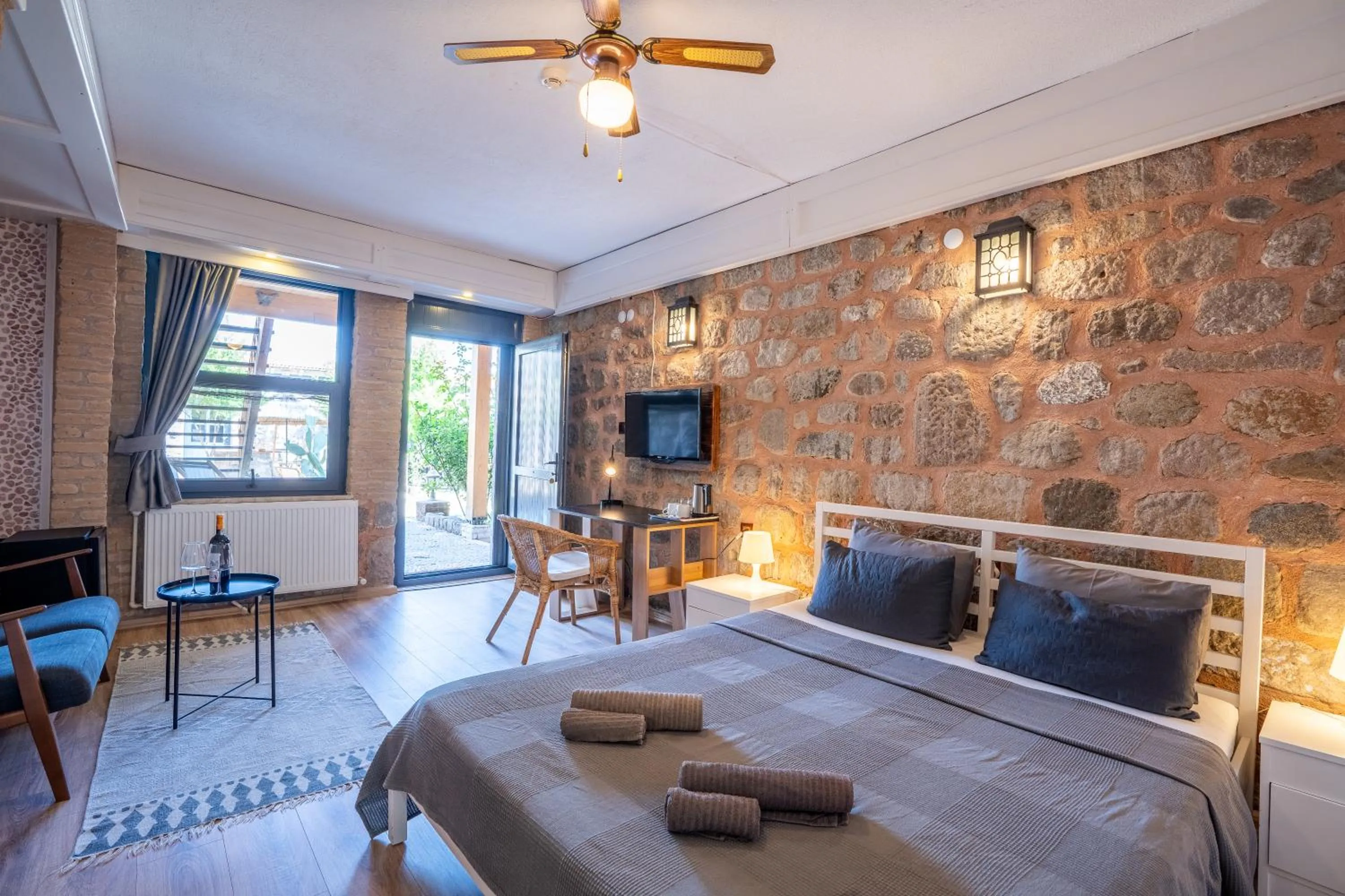 Bed in Attalos Suites Hotel