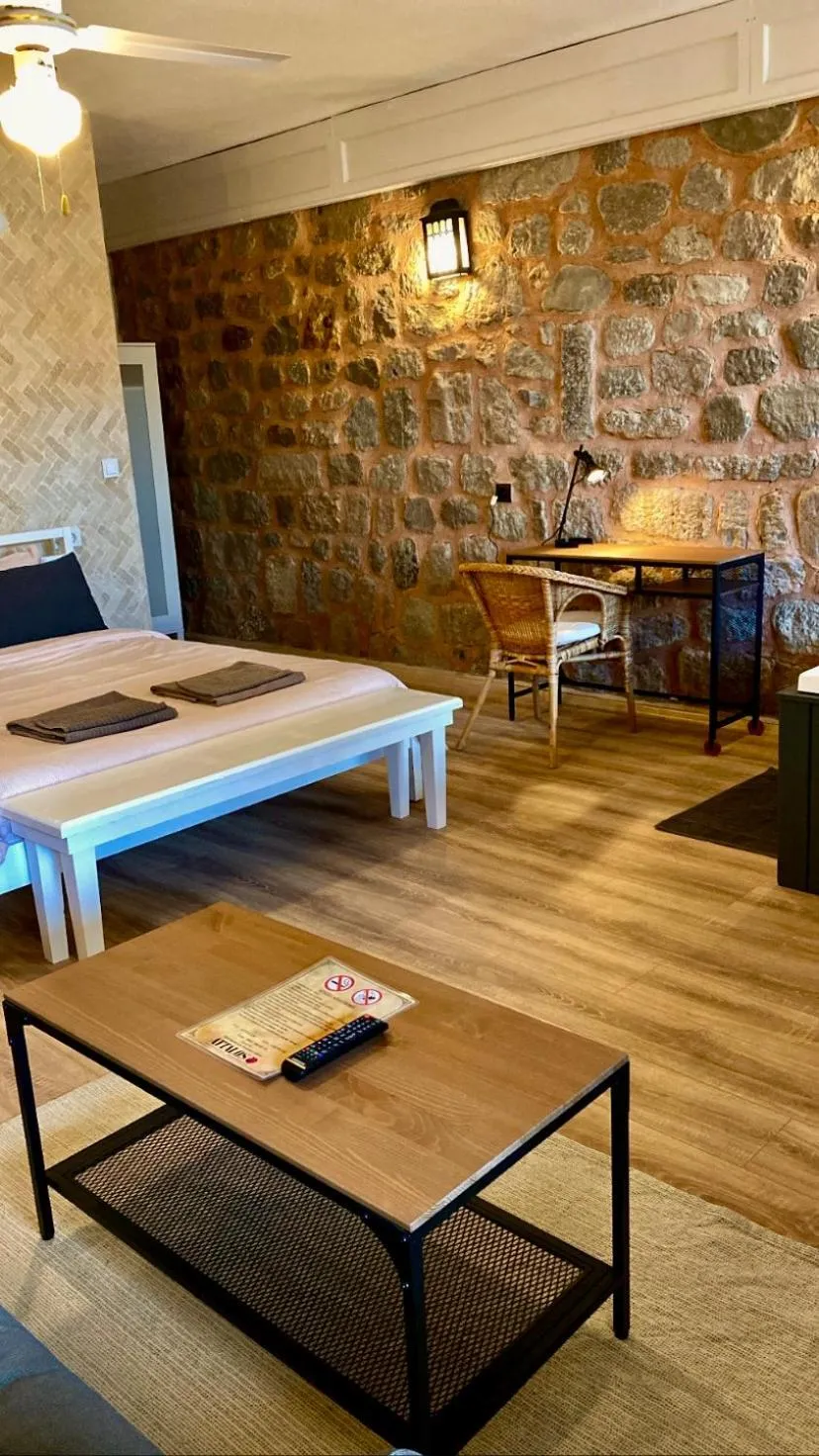 Bed in Attalos Suites Hotel