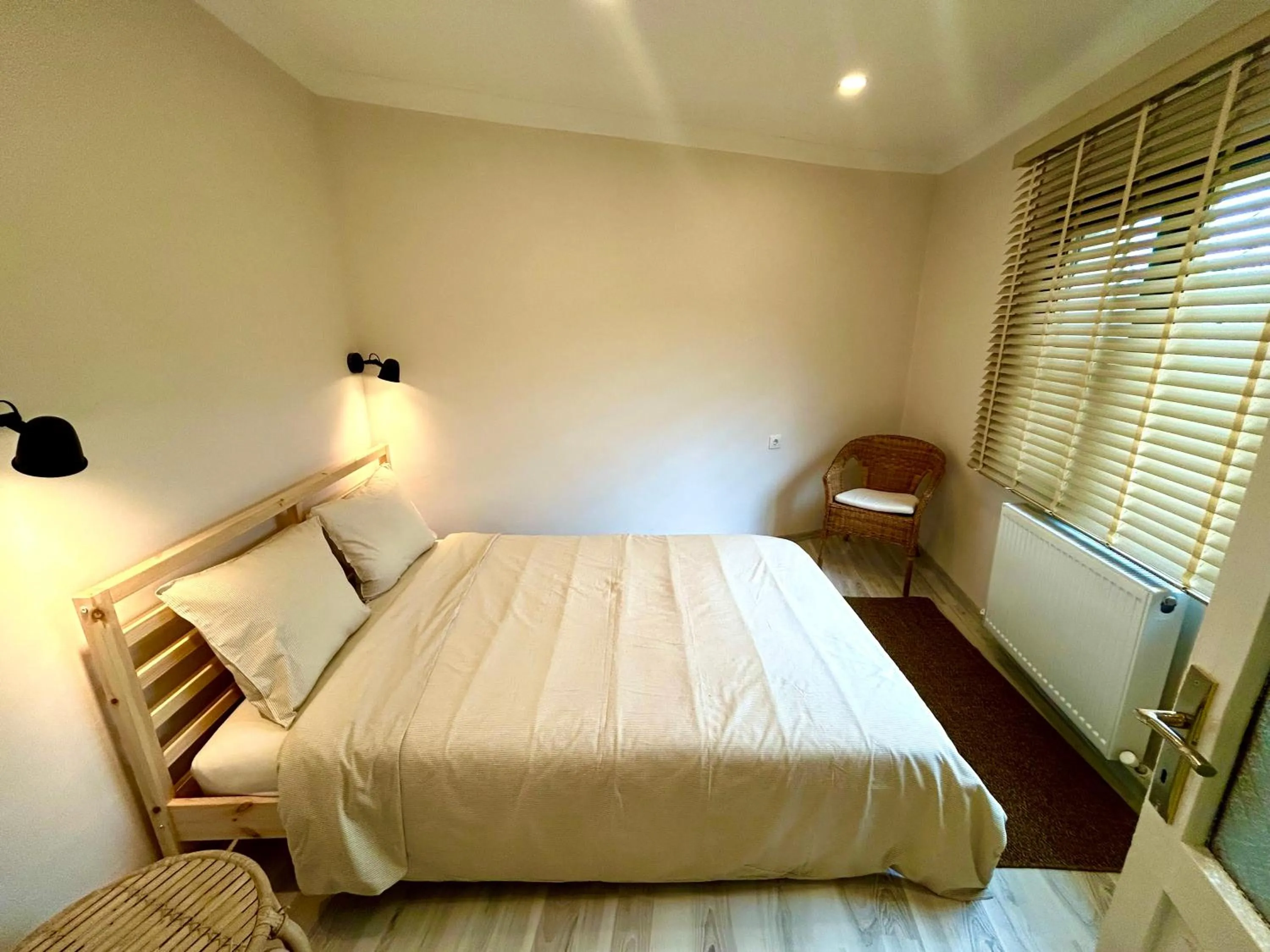 Bed in Attalos Suites Hotel