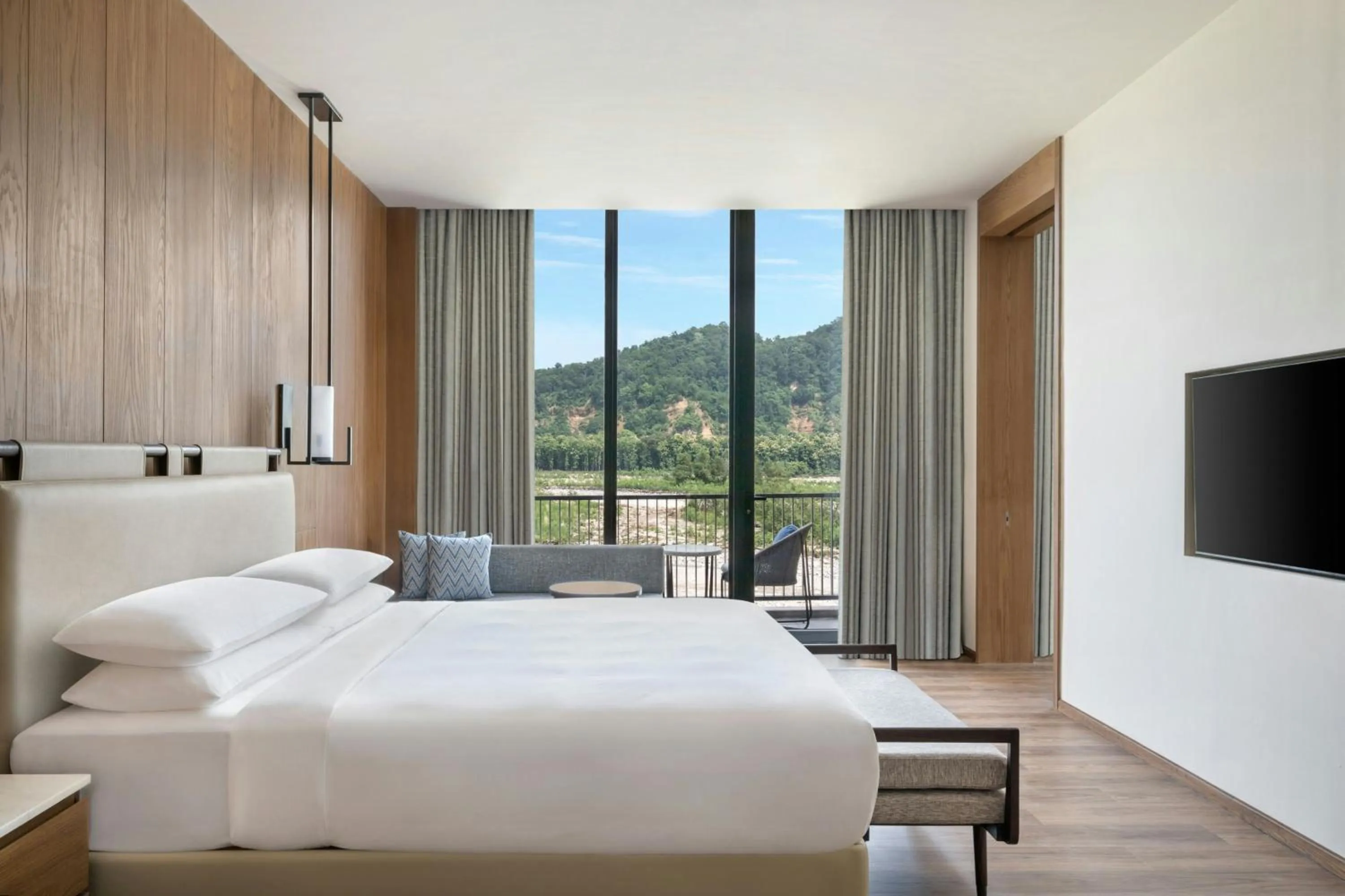 Photo of the whole room, Bed in Jim Corbett Marriott Resort & Spa