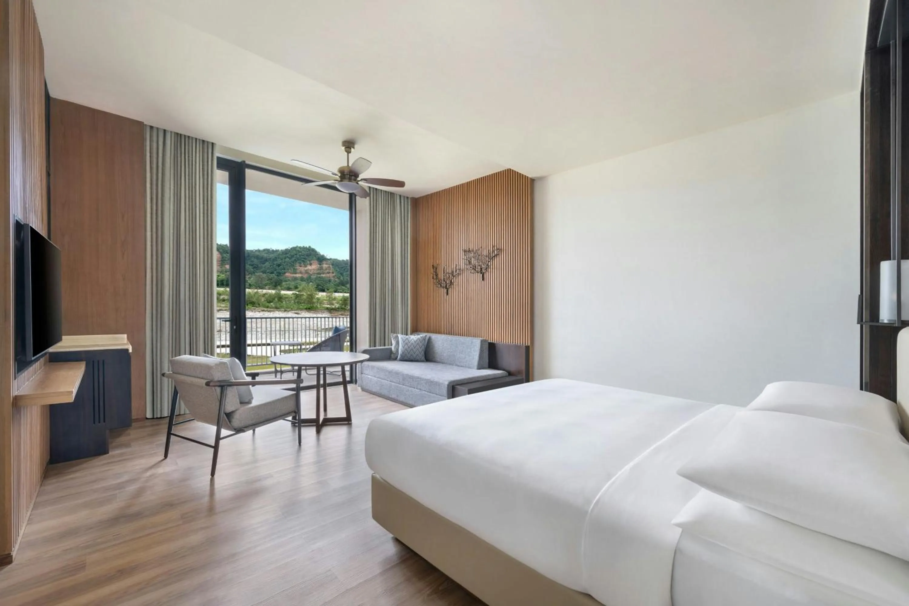 Photo of the whole room, Bed in Jim Corbett Marriott Resort & Spa