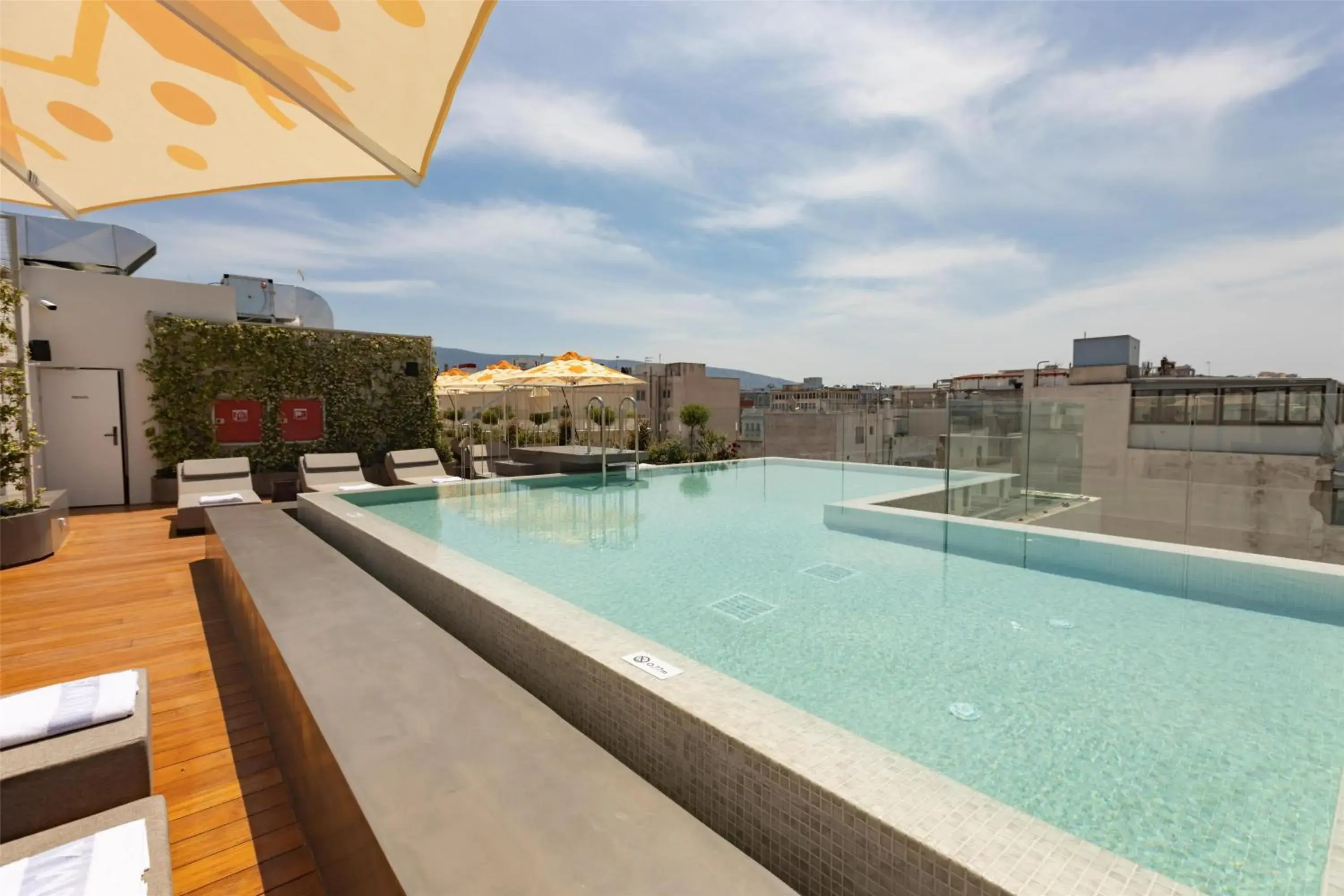 Pool view in Adia Aluma Athens, Curio Collection By Hilton Pool view in Adia Aluma Athens, Curio Collection By Hilton